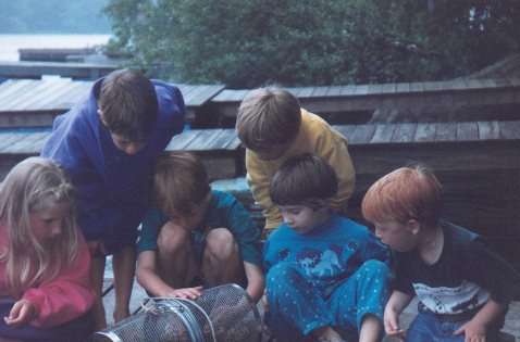 The kids checking the minnow trap for crawfish and other critters!