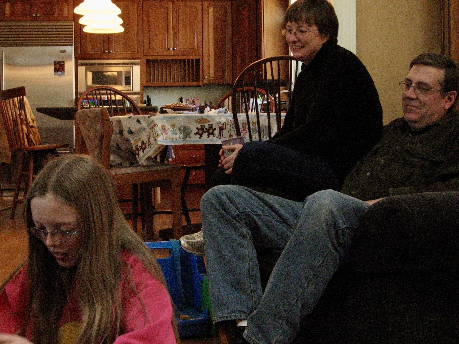 Alan relaxing with family in a living room