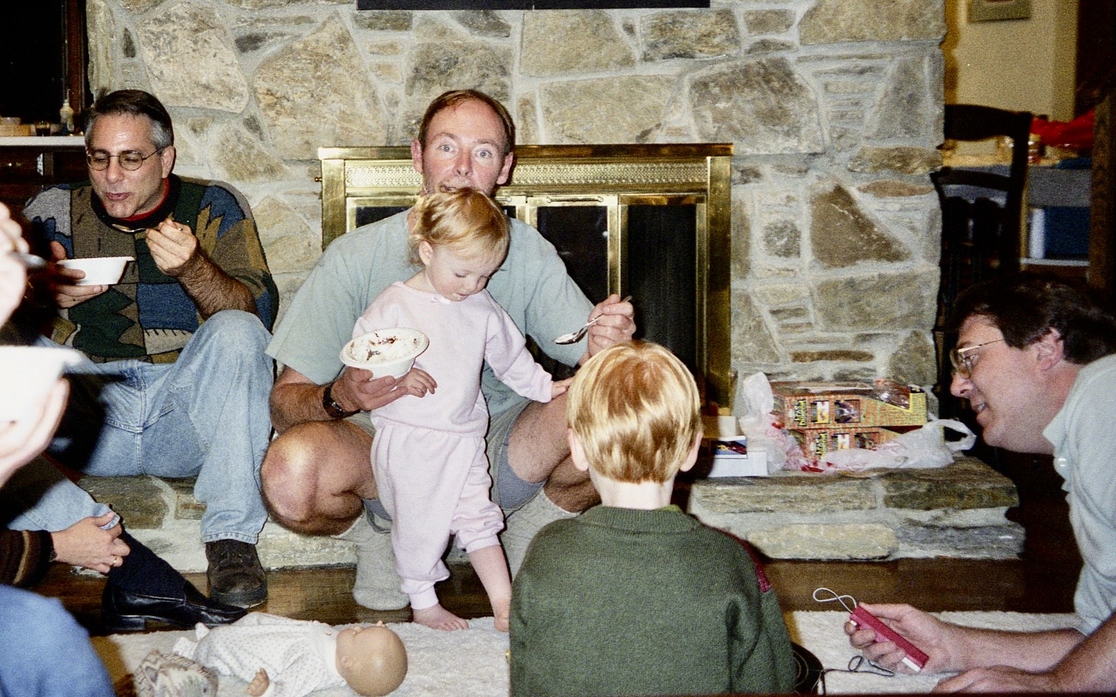 Alan playing with children during a family gathering