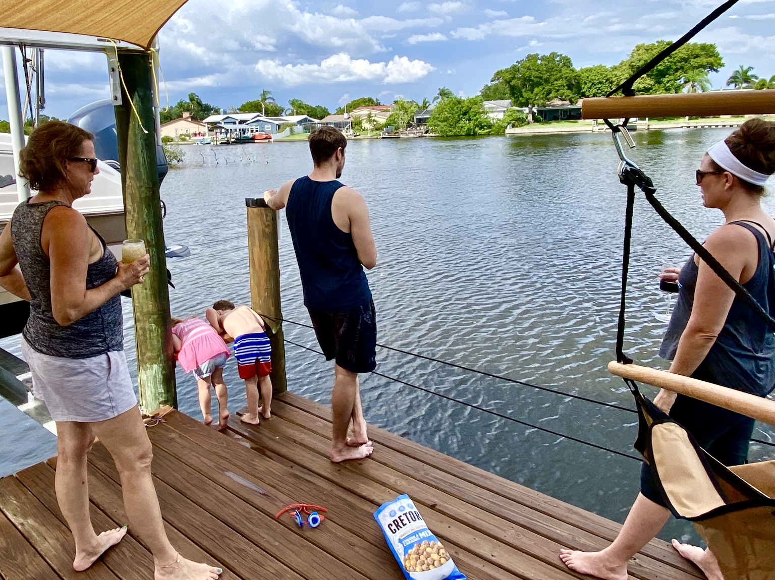 Family gathered at the end of the dock to watch the water and wildlife.