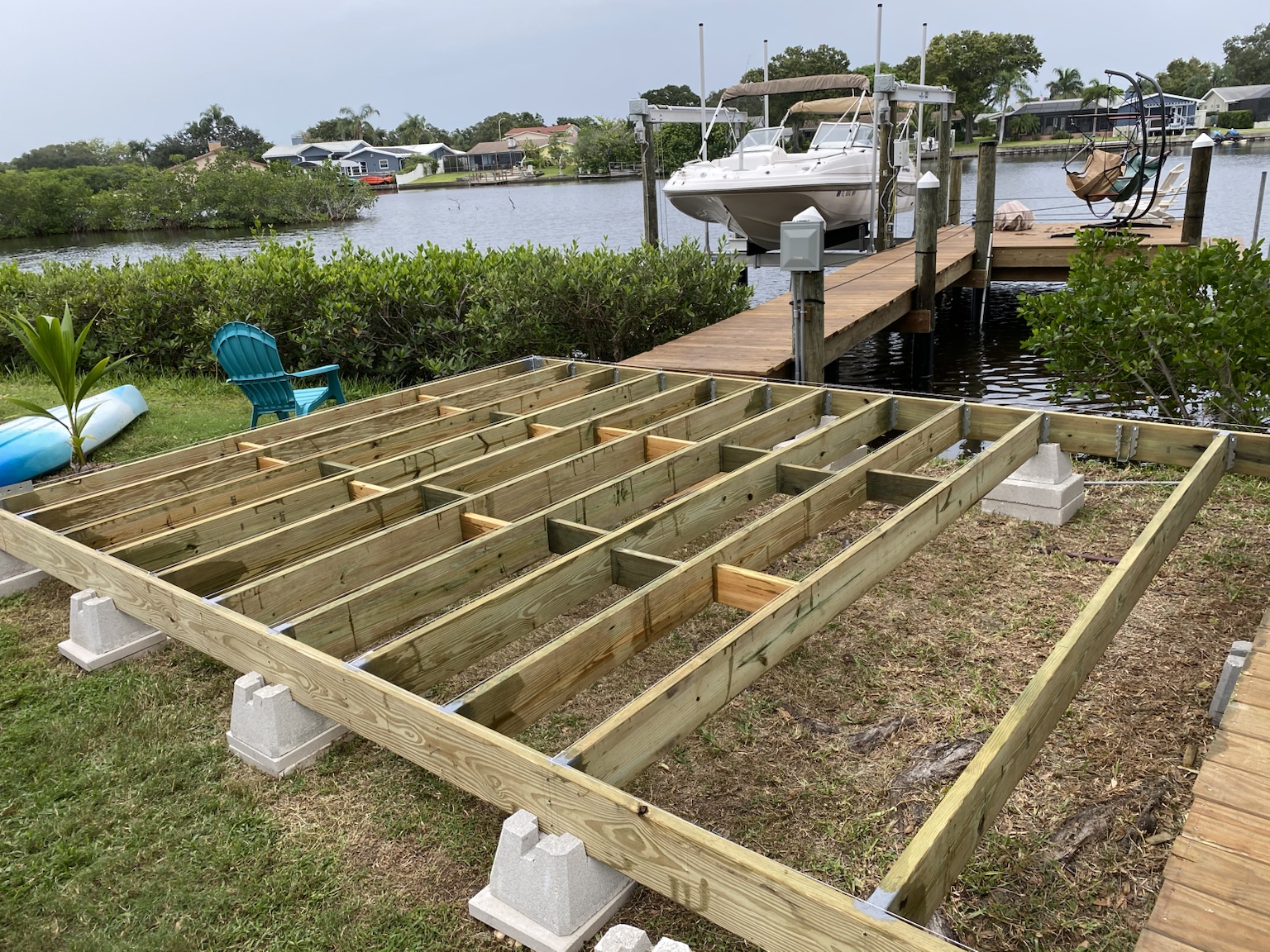 The large deck beginning to take shape beneath the giant oak trees.