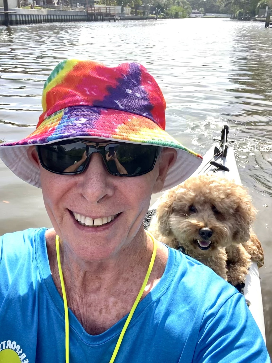 Tie-dye hat, big smile, tiny curly navigator: another excellent day afloat.