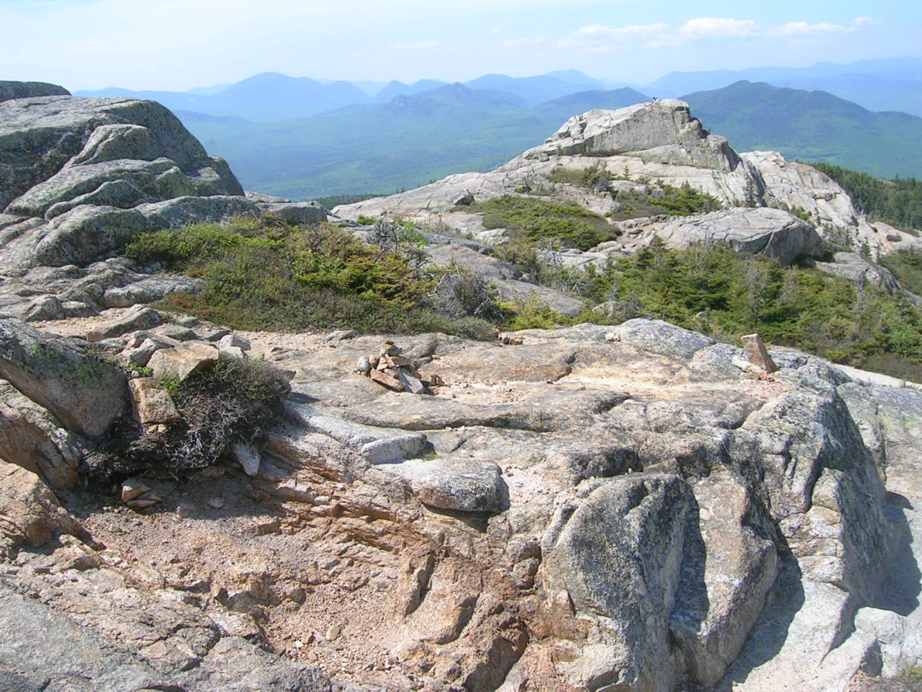 Near the summit, with tons of ledge for hanging out or scrambling.