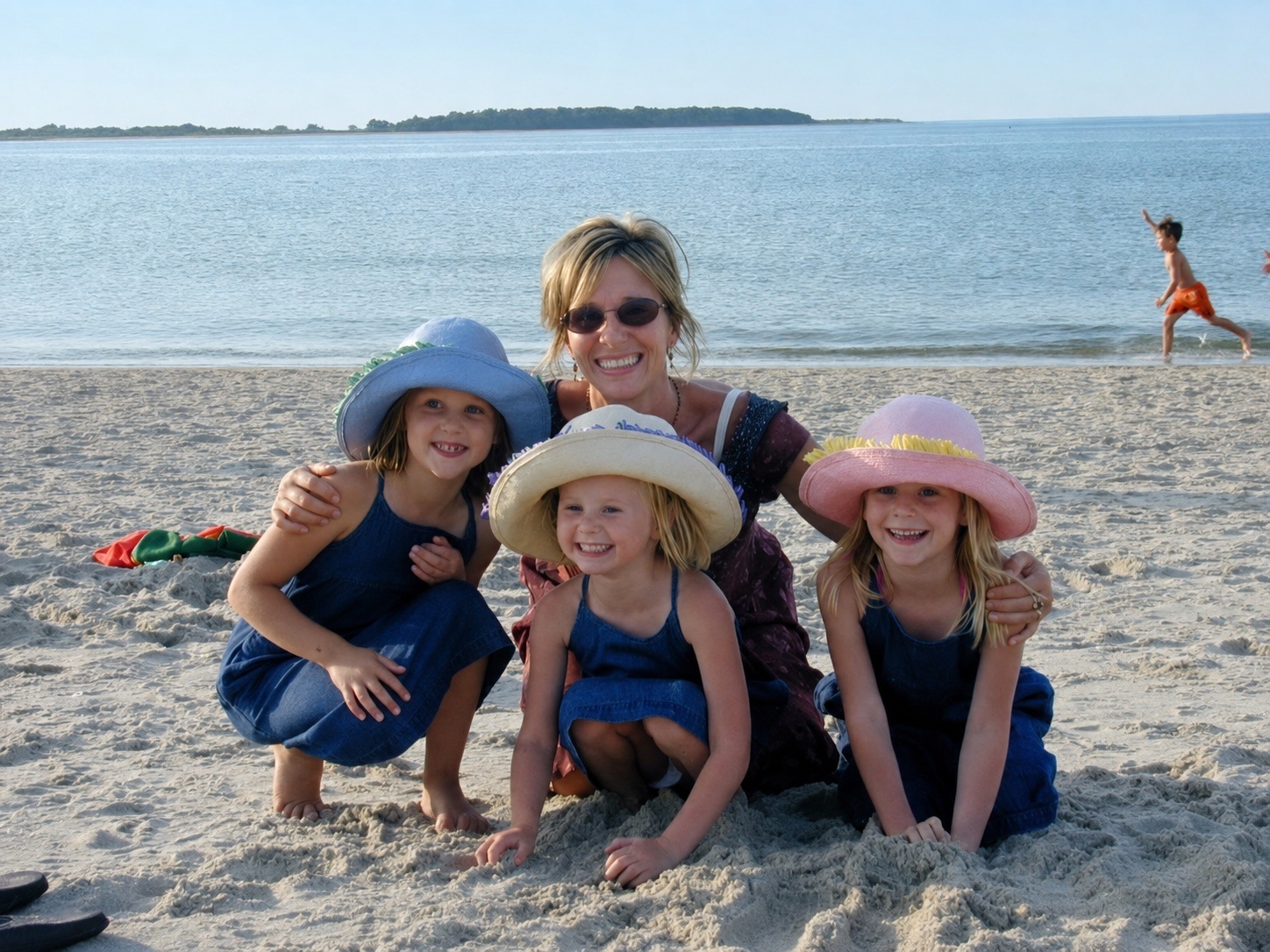 Liz with Juliet, Izzy, and Lily at the beach