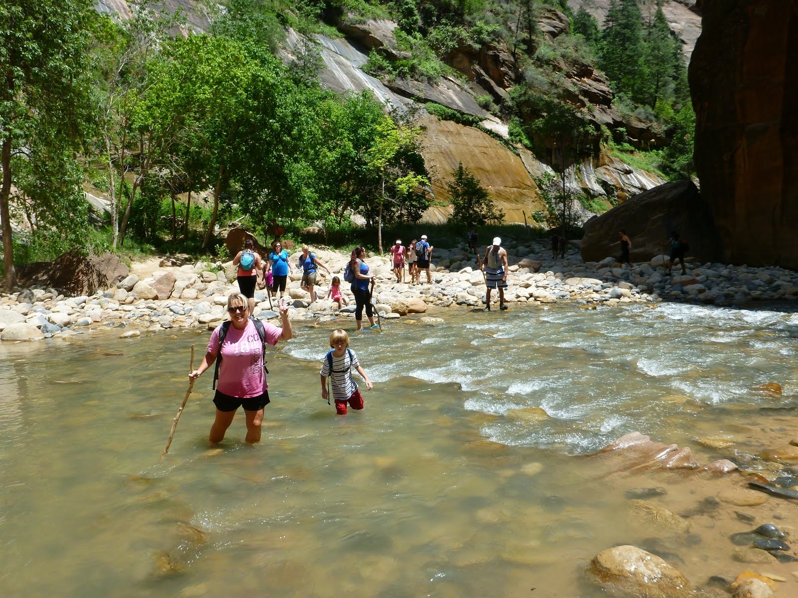 Cindy crossing a broad, sunlit section of the river.