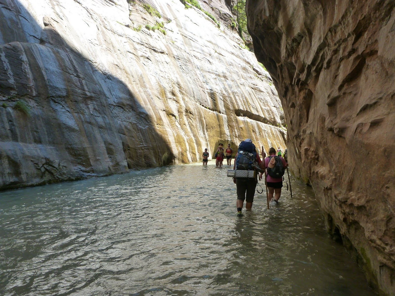 A deeper passage where the river fills the space between curving canyon walls.