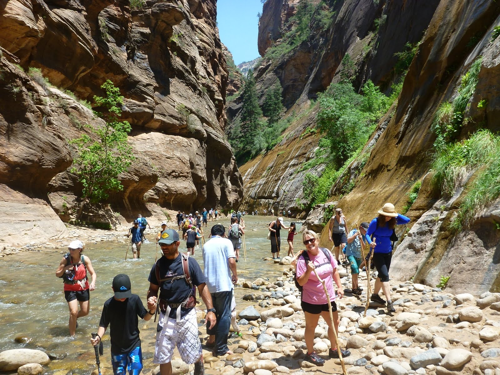 The first steps into the Virgin River, where the paved walk ends and the river itself becomes the trail.