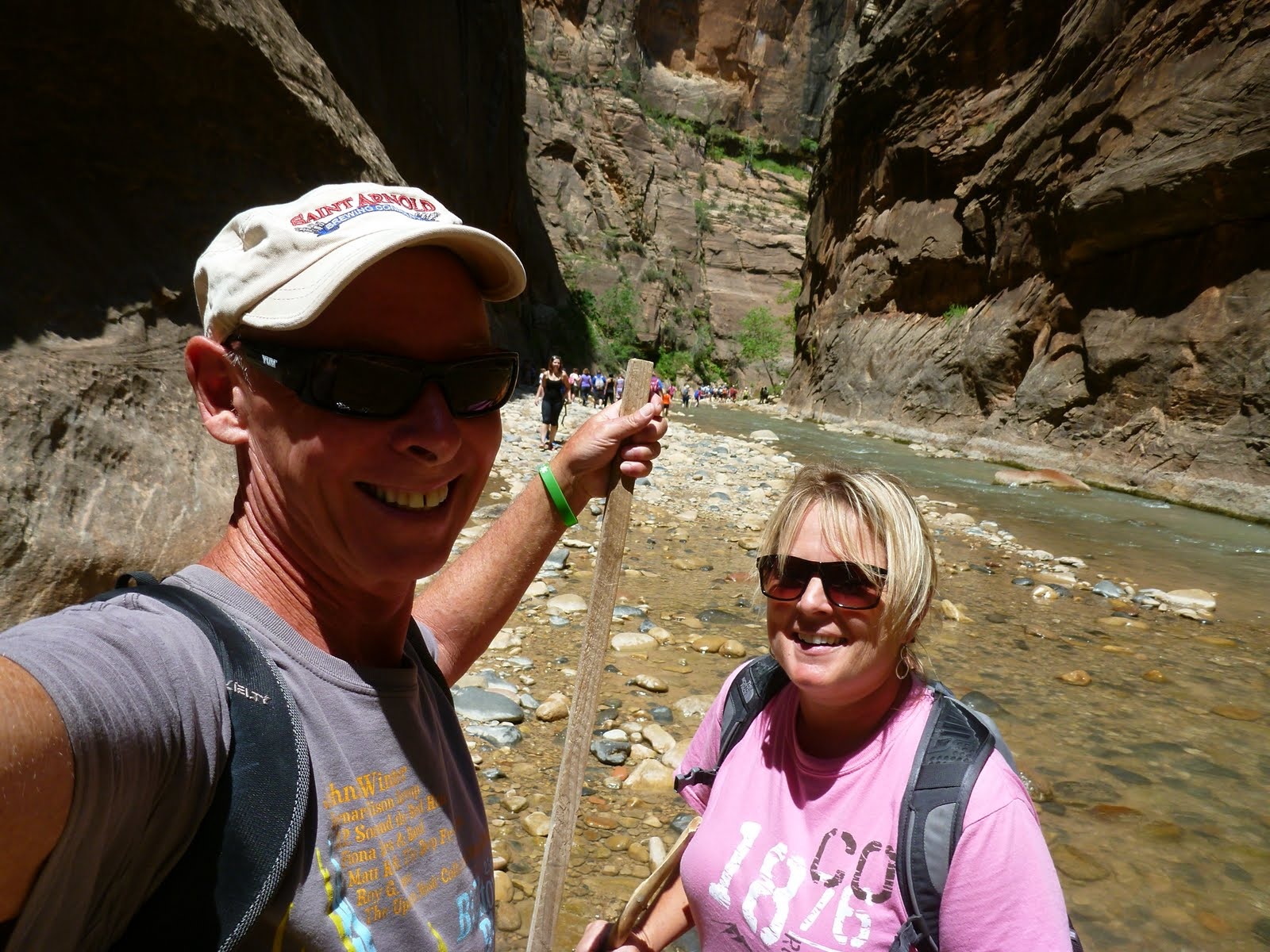 Tim pointing farther up the canyon as the walls close in.
