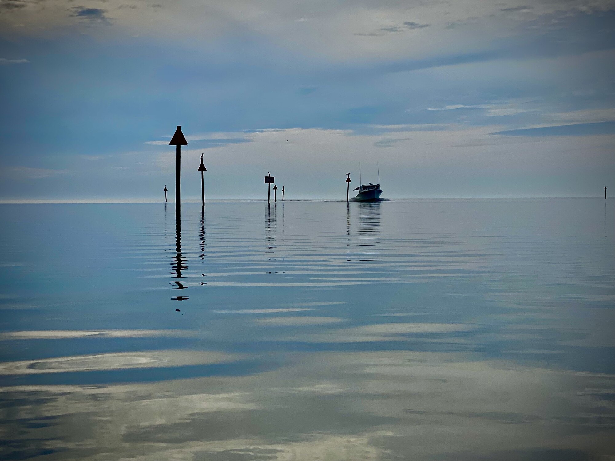 Channel markers and small boats near Aripeka