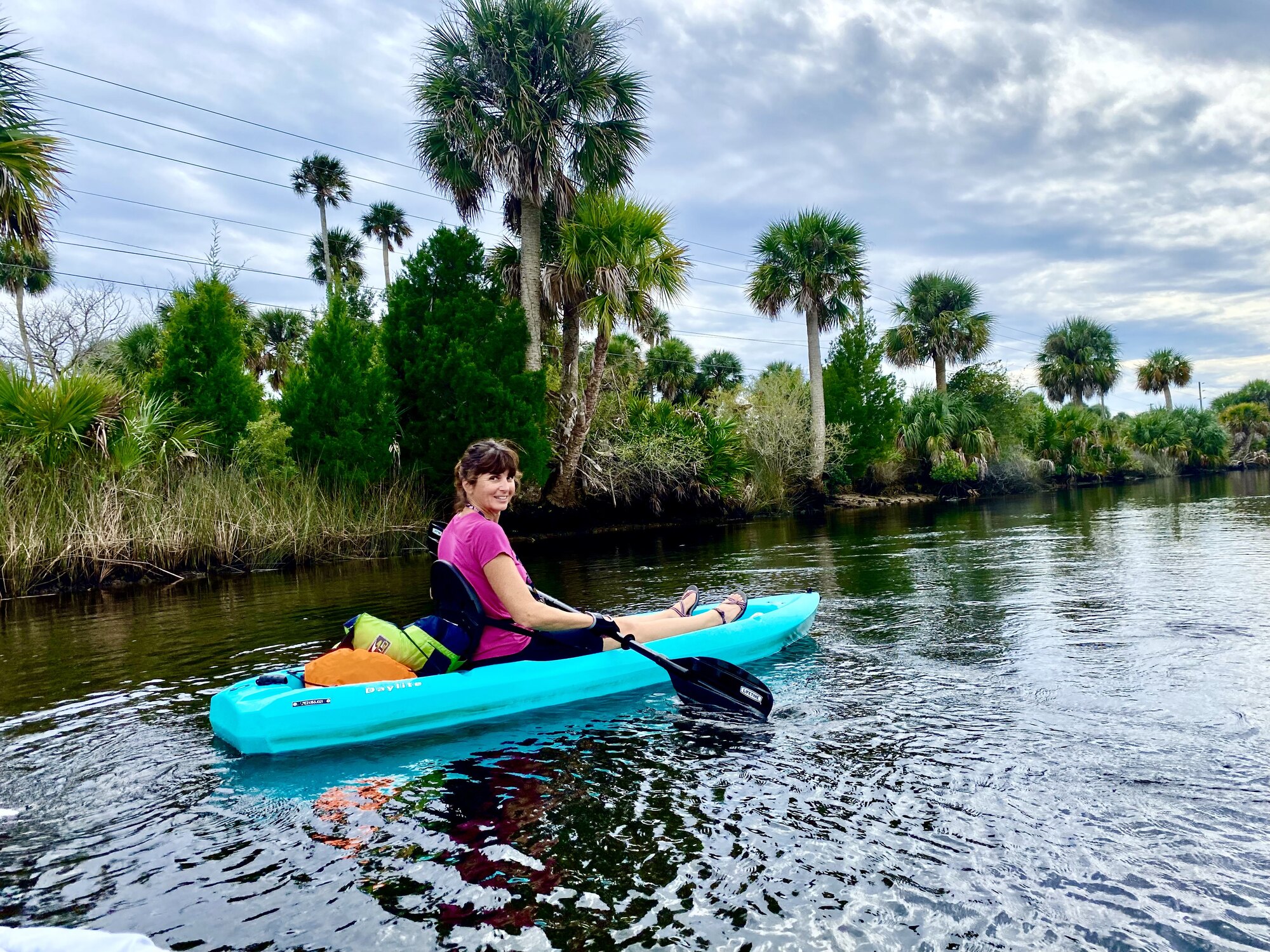 Diana turning her turquoise kayak