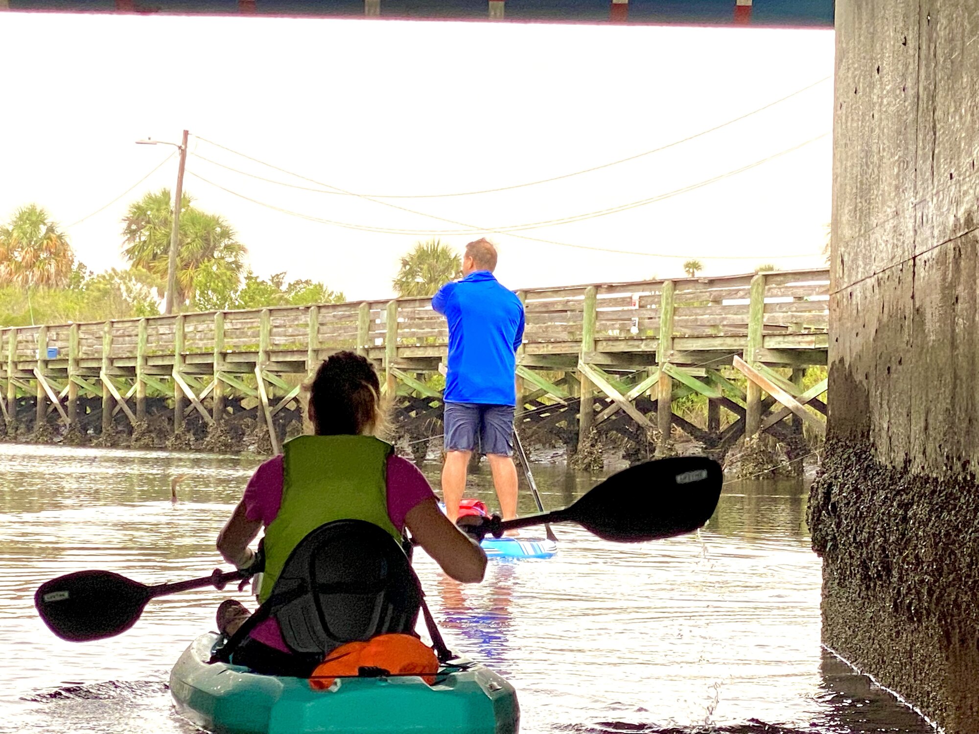 Diana and David moving through the shaded bridge opening