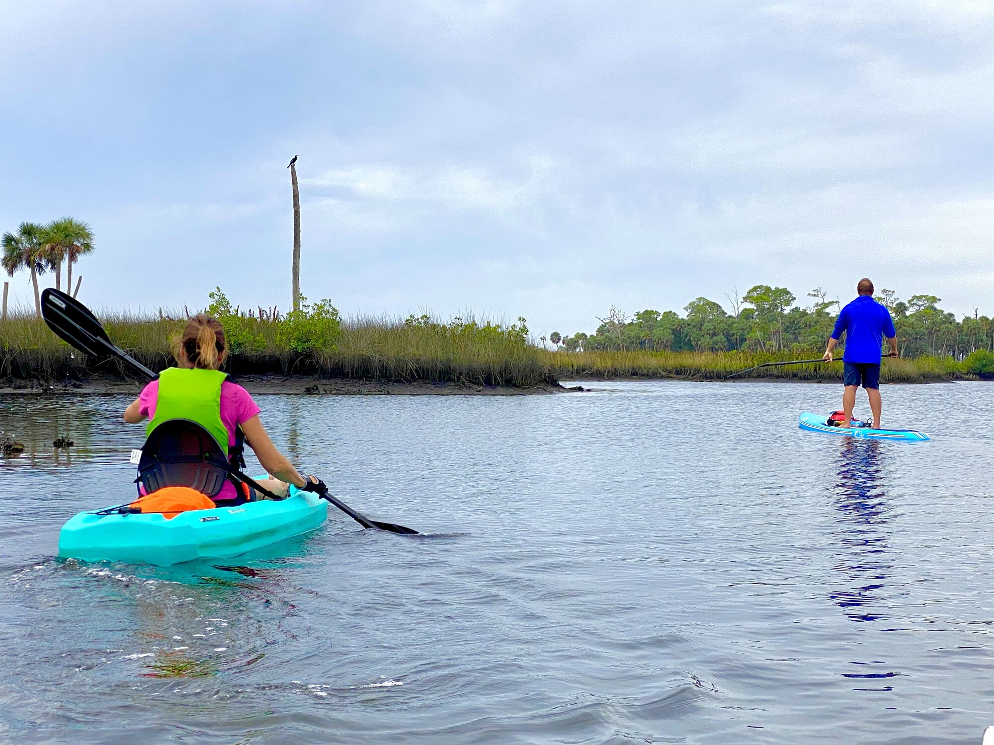 Diana and David leaving the bridge and entering coastal marsh