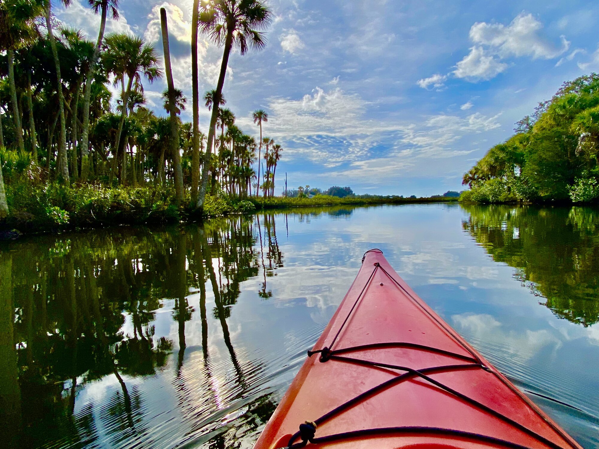 Red kayak bow on a calm Aripeka creek