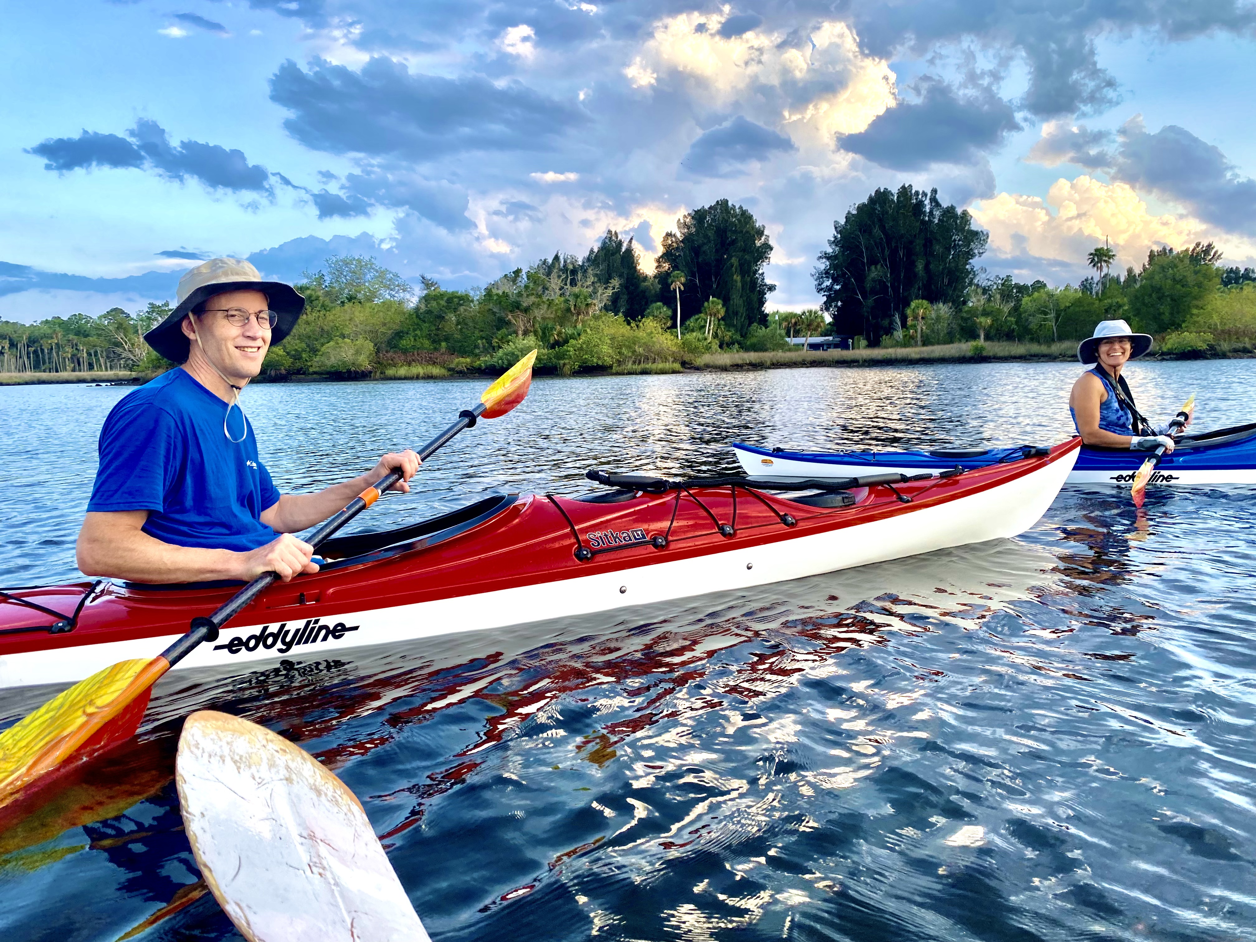 Friends kayaking together on the open water near Aripeka