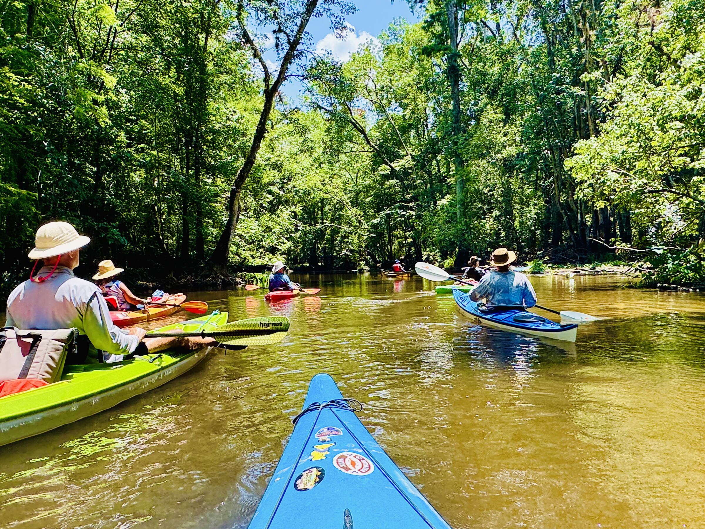 The group regrouping on a wider reach of river