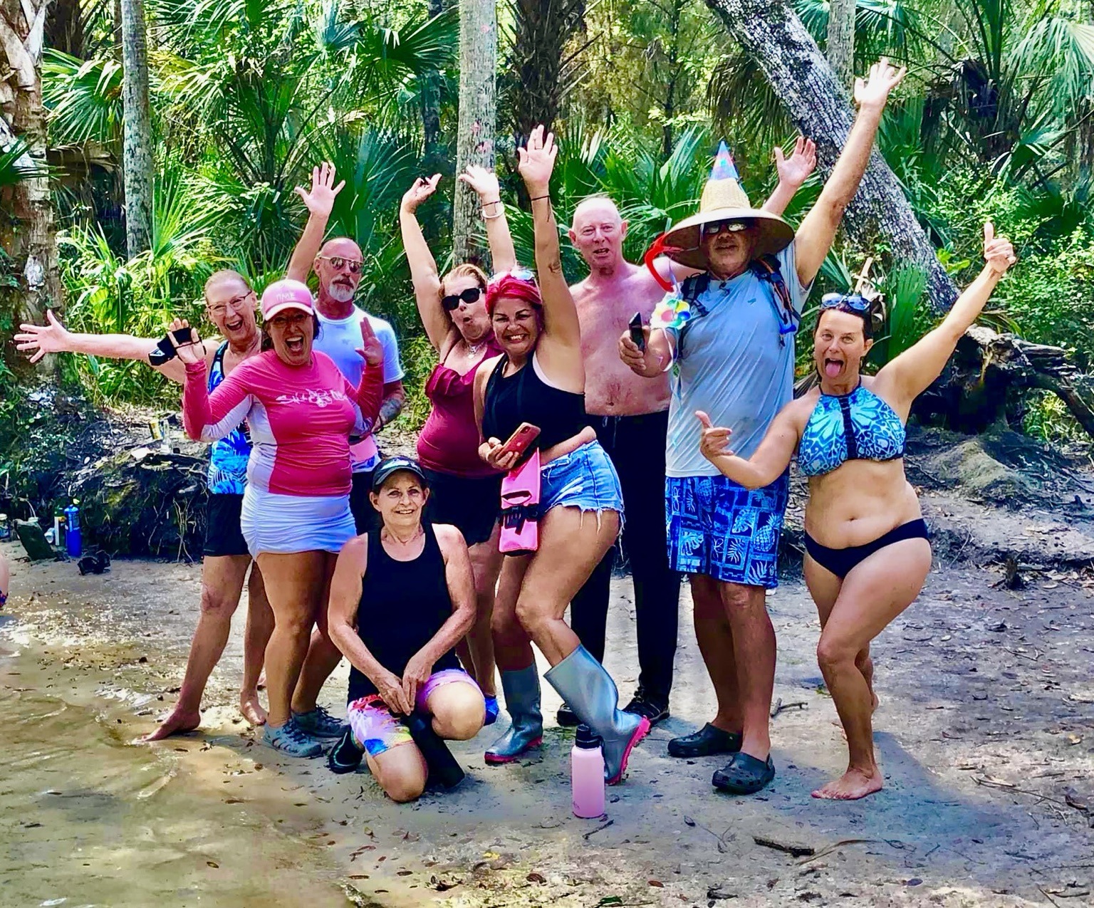 The whole crew celebrating Layne's birthday at the spring, with Layne front and center in the giant pointed birthday hat.