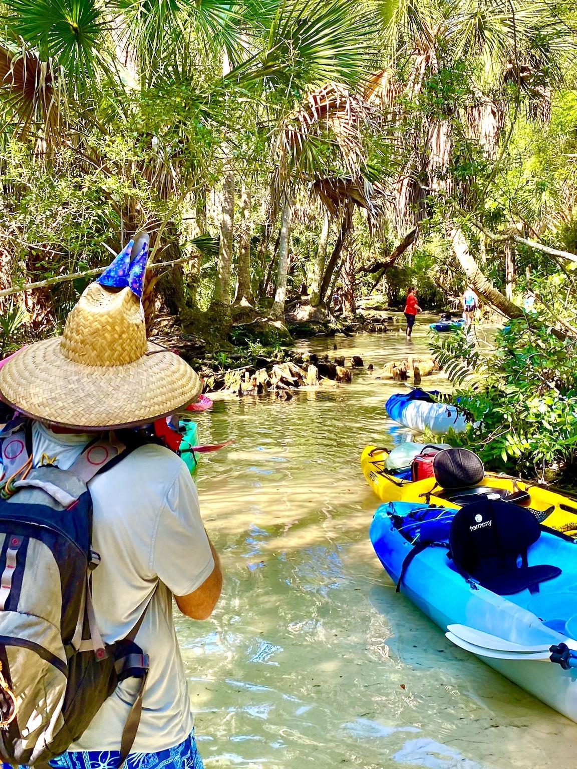 Layne walking through the spring shallows with the giant birthday hat still going strong.