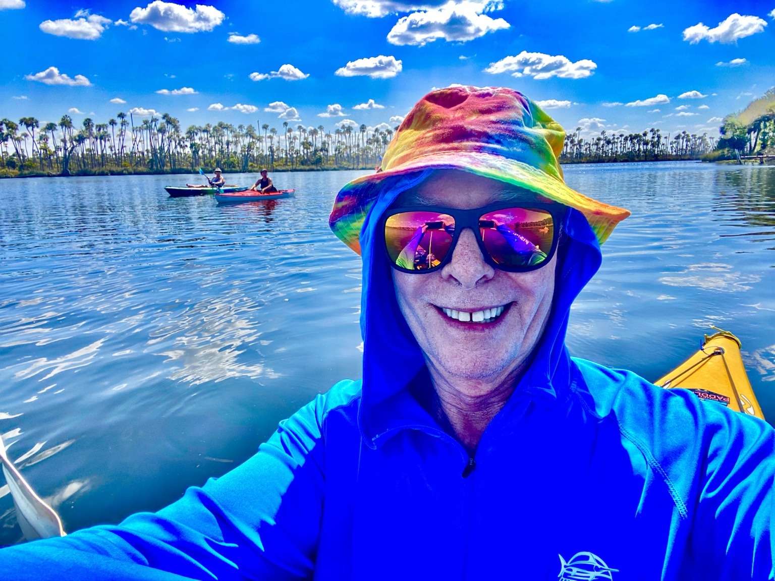 A bright birthday-paddle selfie on the open river.