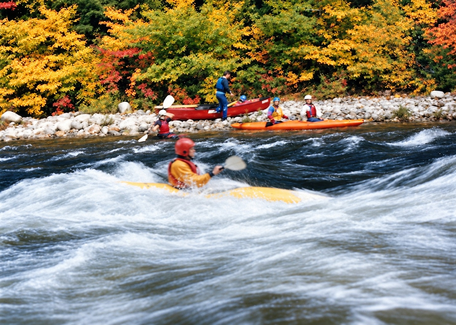 Vermont, 1990: kayaking through whitewater beneath autumn foliage.