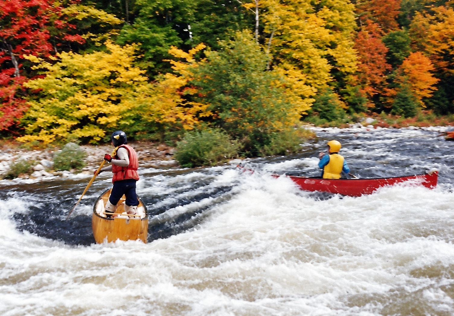Vermont, 1990: canoes navigating the rapids.