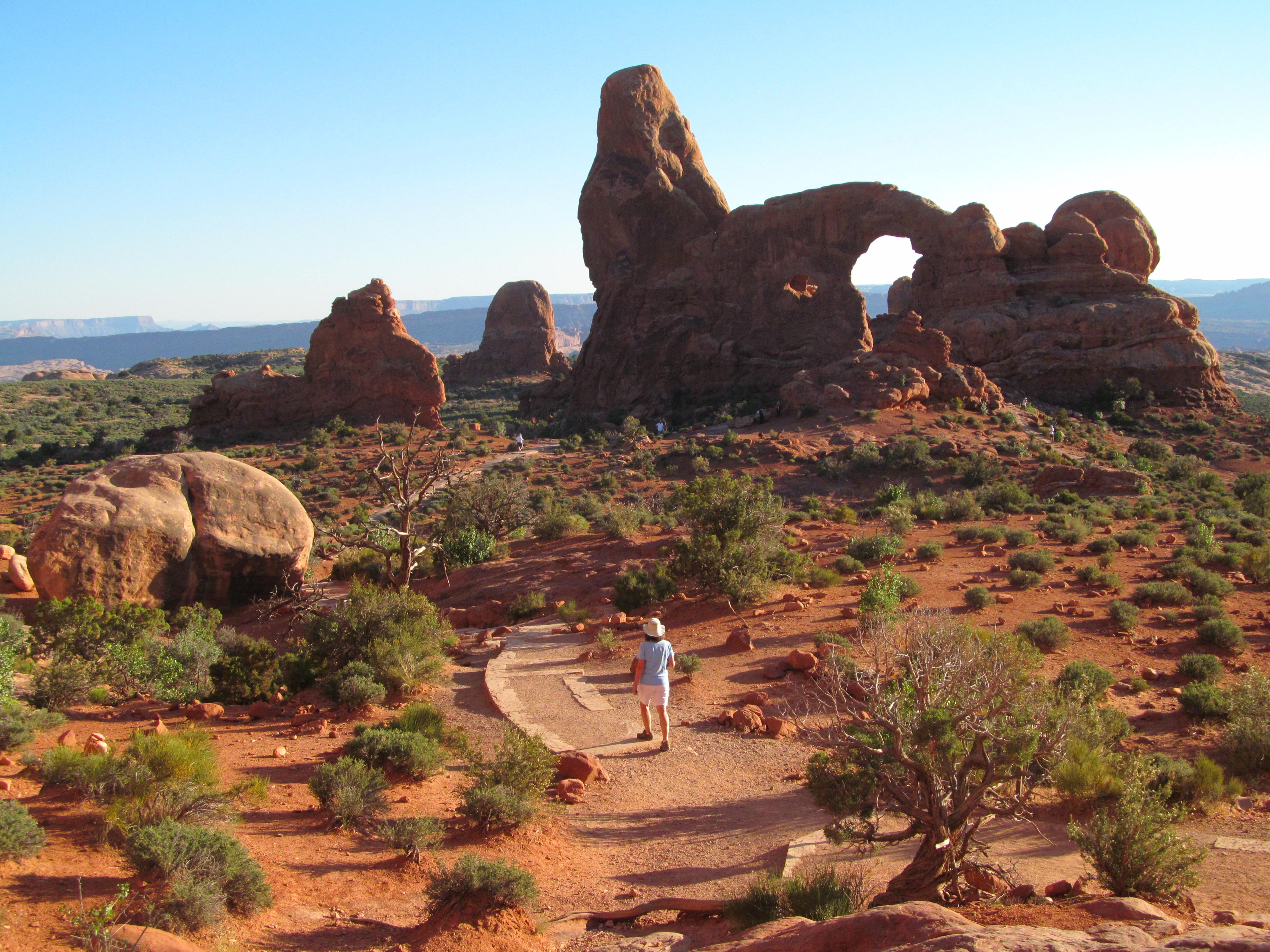 A broad panorama of fins, arches, and red desert terrain.