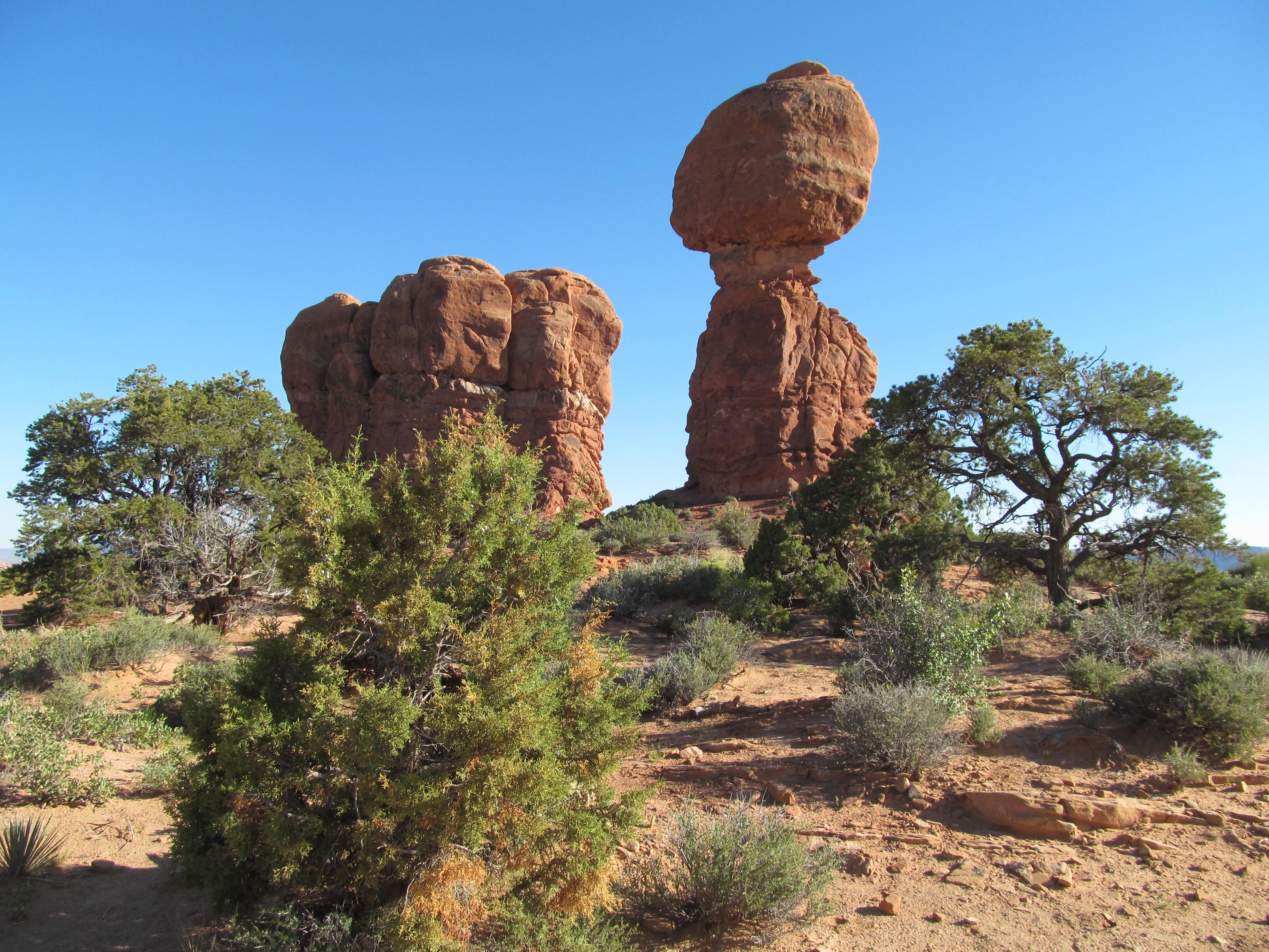 Balanced Rock rising above the desert floor in Arches National Park.