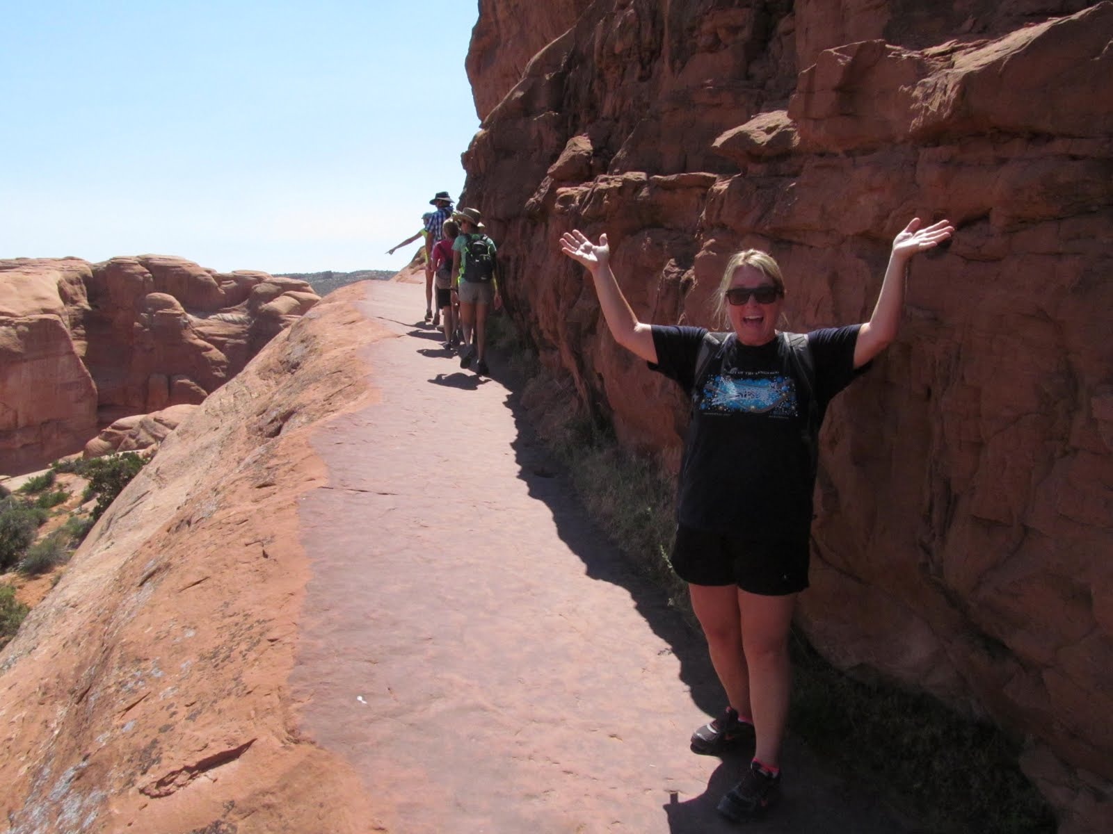 Cindy celebrating along the Delicate Arch trail.