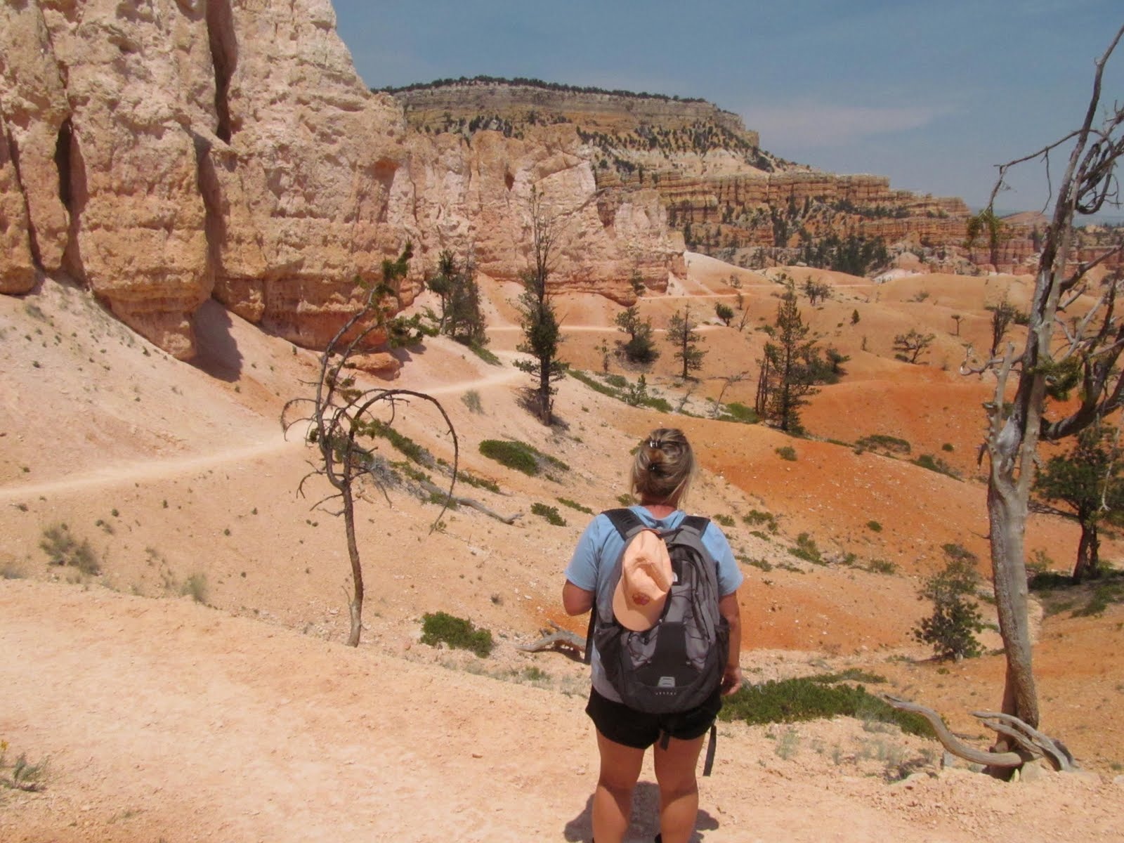 Cindy descending a dusty trail through Bryce Canyon.