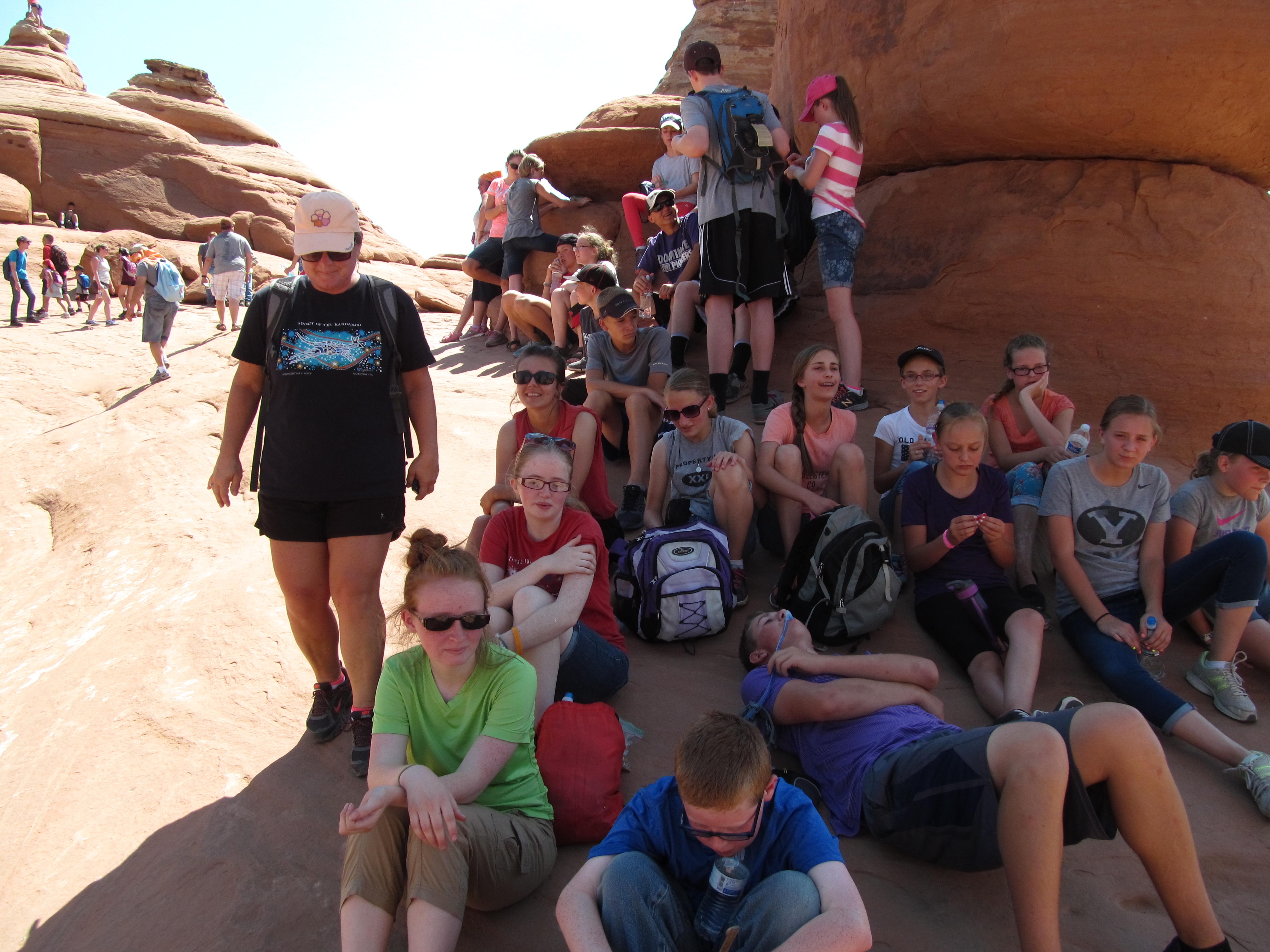 A crowded shade break during the hot hike to Delicate Arch.