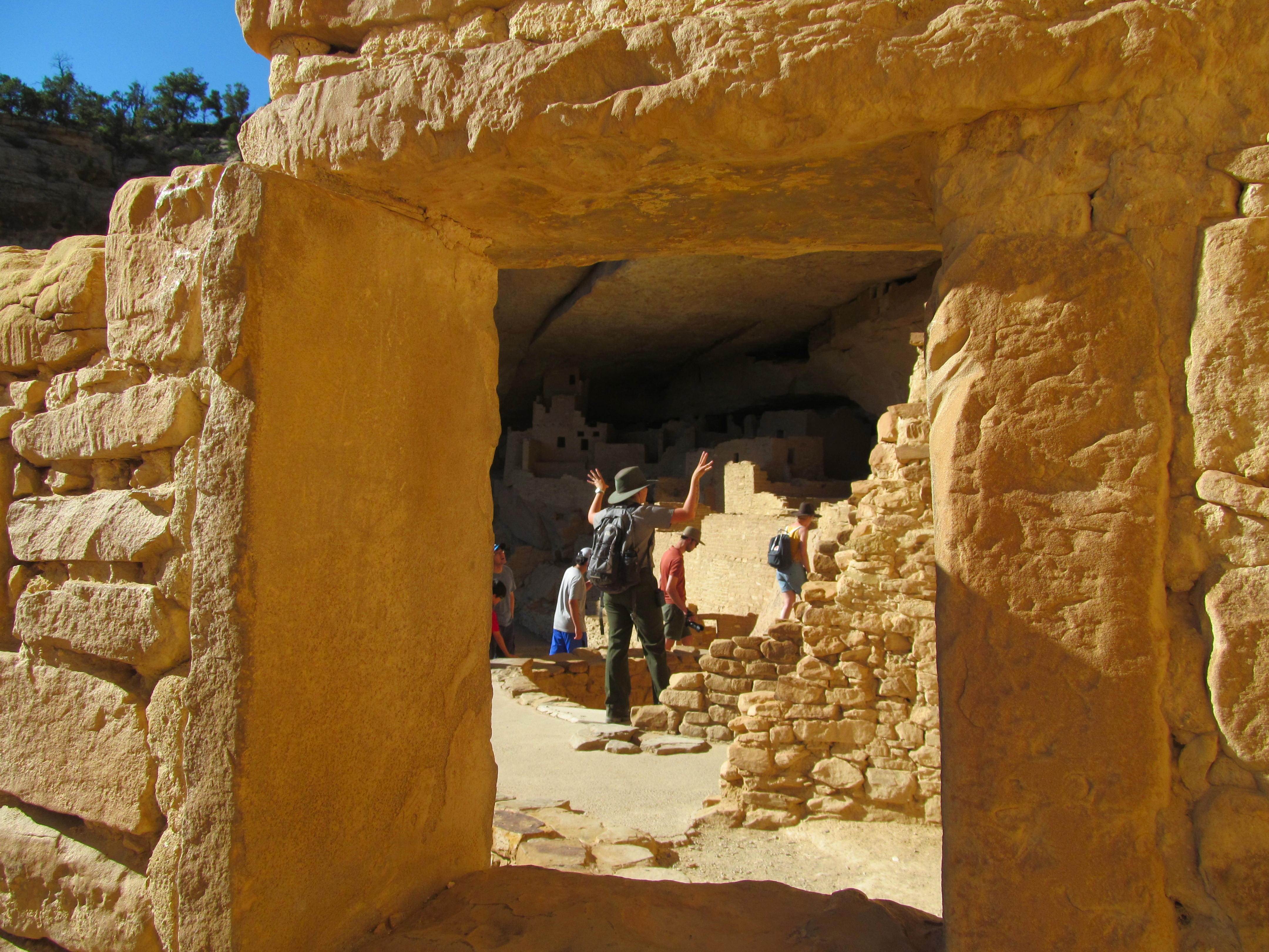 A doorway framing the stone rooms beyond in a Mesa Verde cliff dwelling.