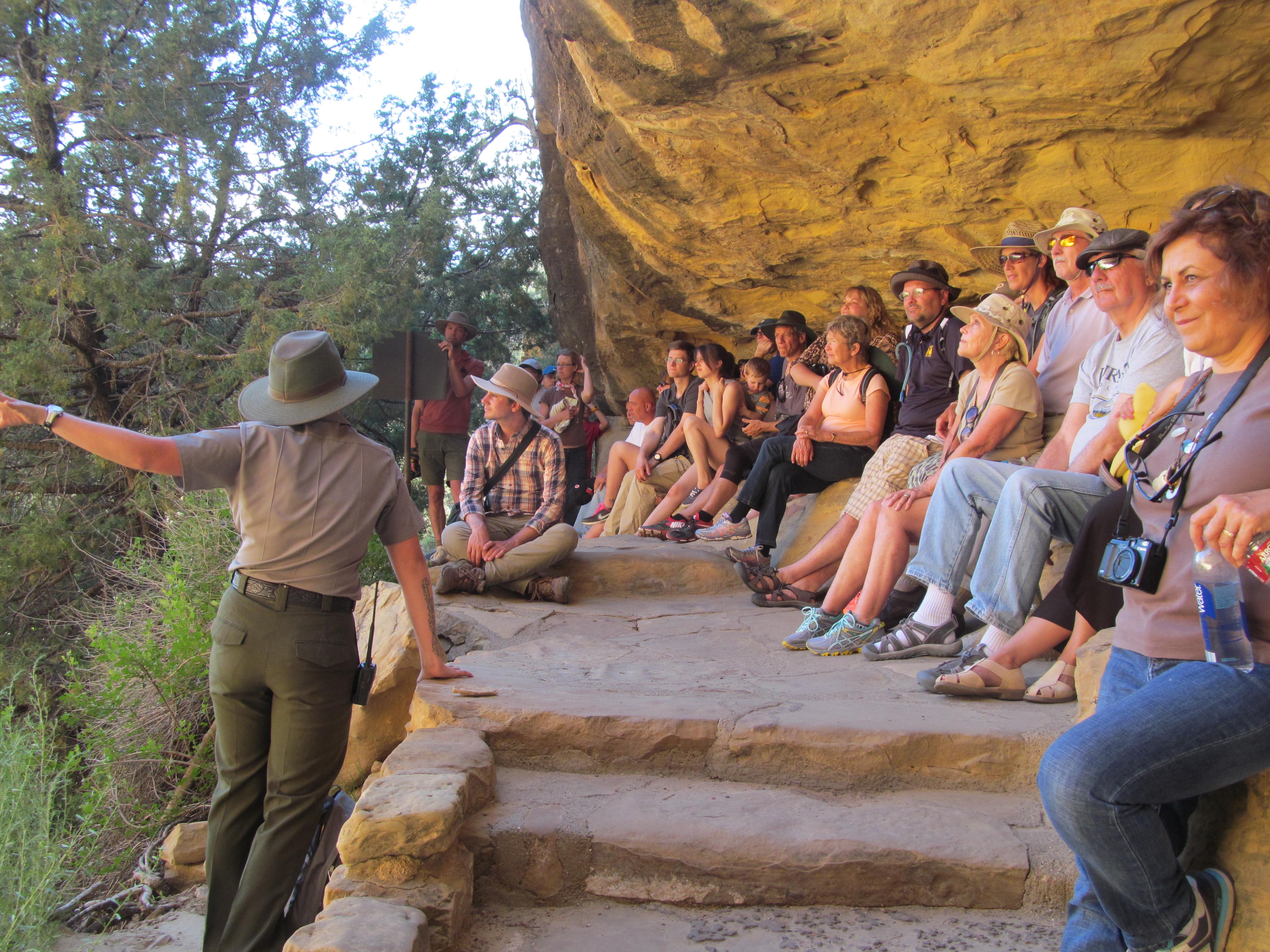 A park ranger explaining the history and archaeology of Cliff Palace.