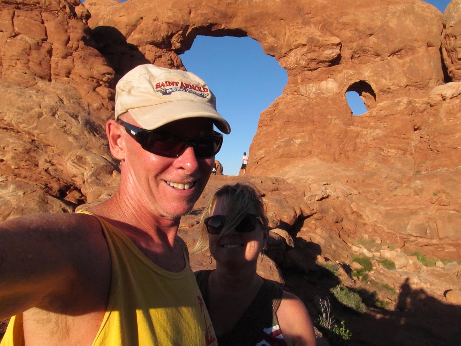 Tim and Cindy smiling together in the heart of Arches National Park.