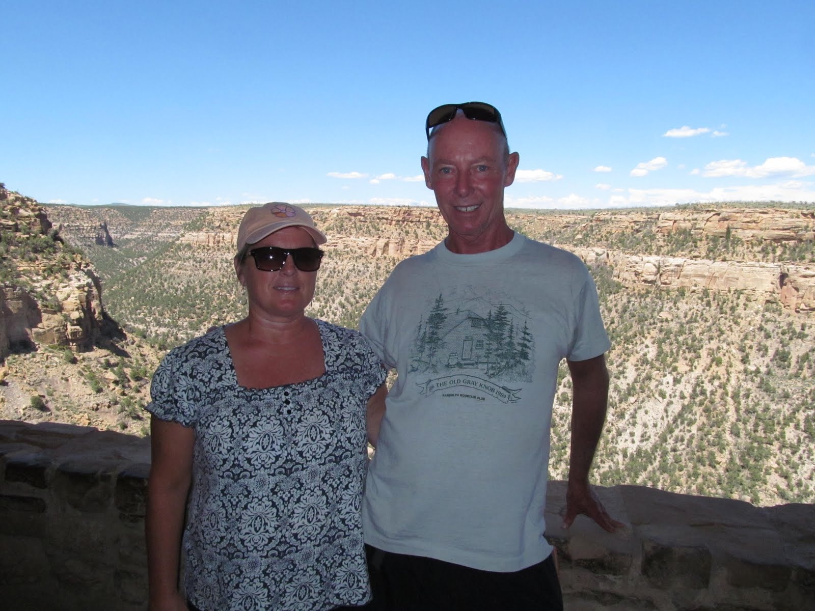 Tim and Cindy at an overlook above the broad Mesa Verde landscape.
