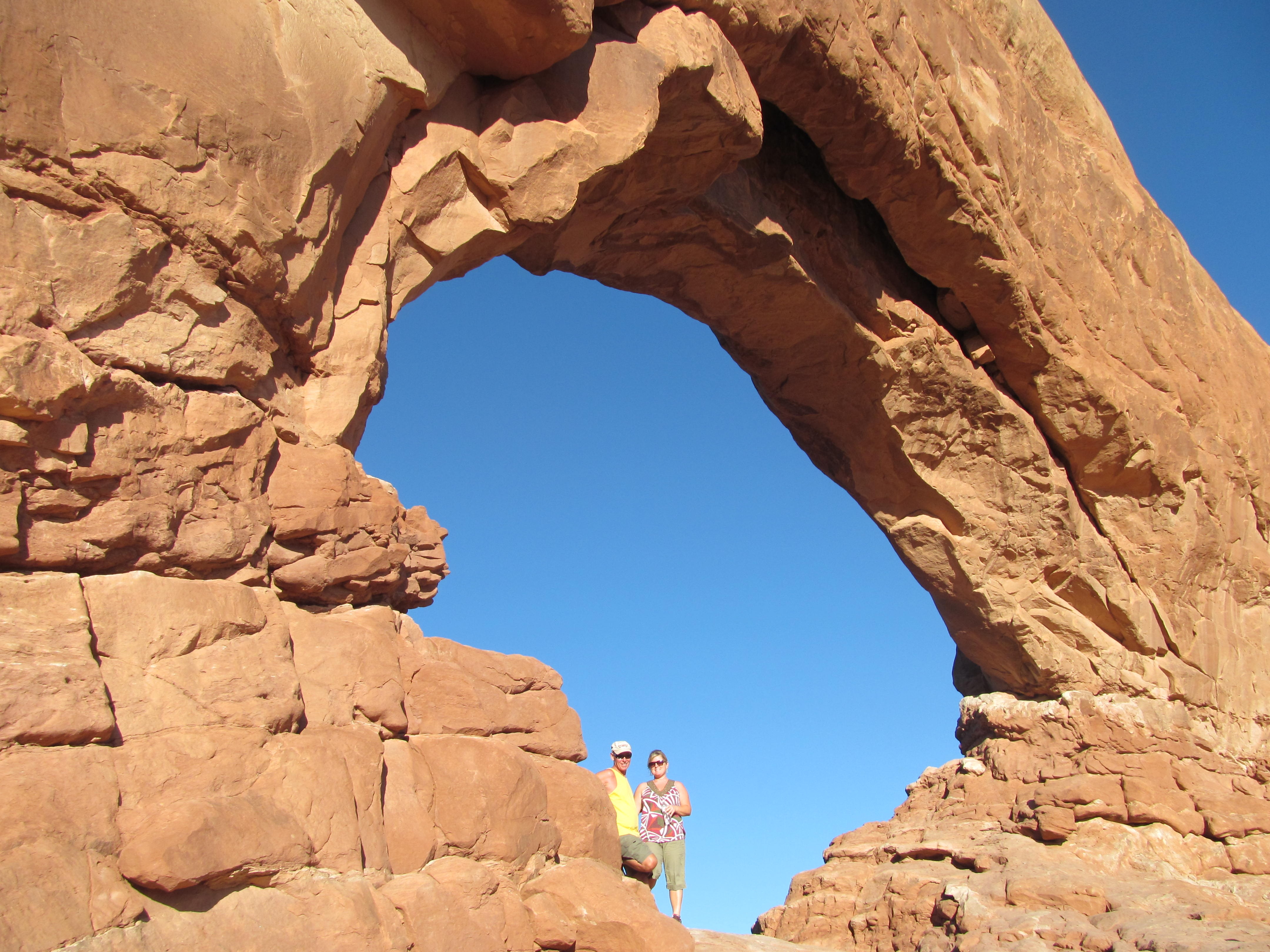 A sandstone window framing the deep blue Utah sky.