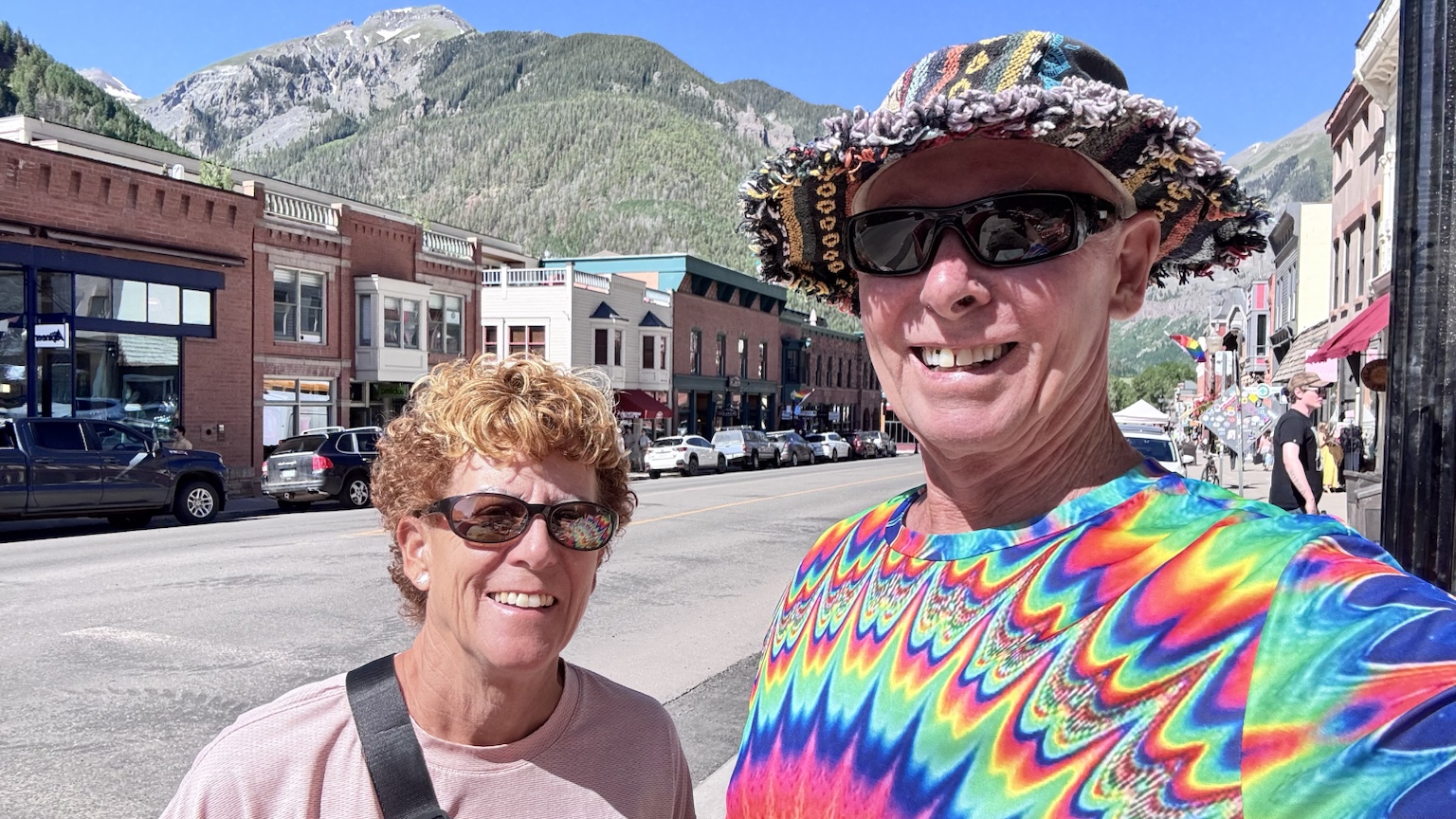 Tim and Kym on a colorful mountain-town street during their Colorado travels.