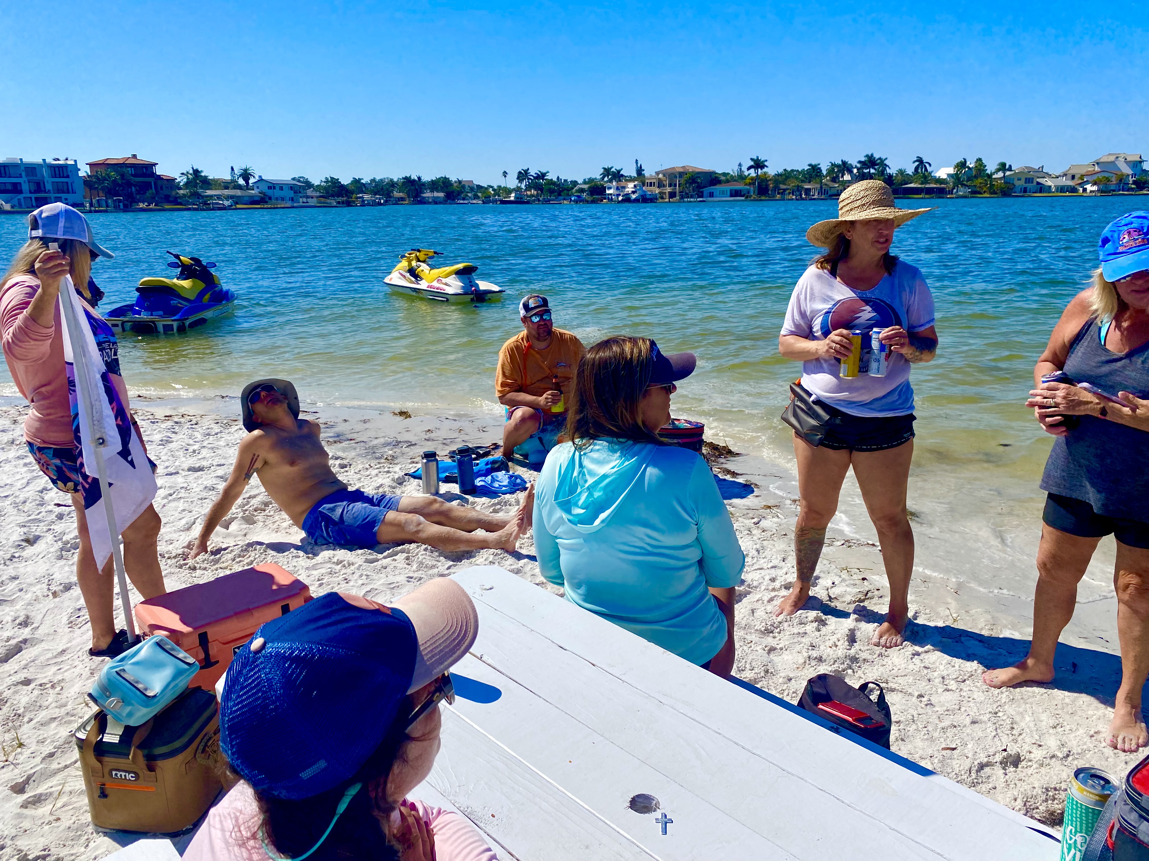 Paddlers, dogs, and boats all share the easygoing island stop.
