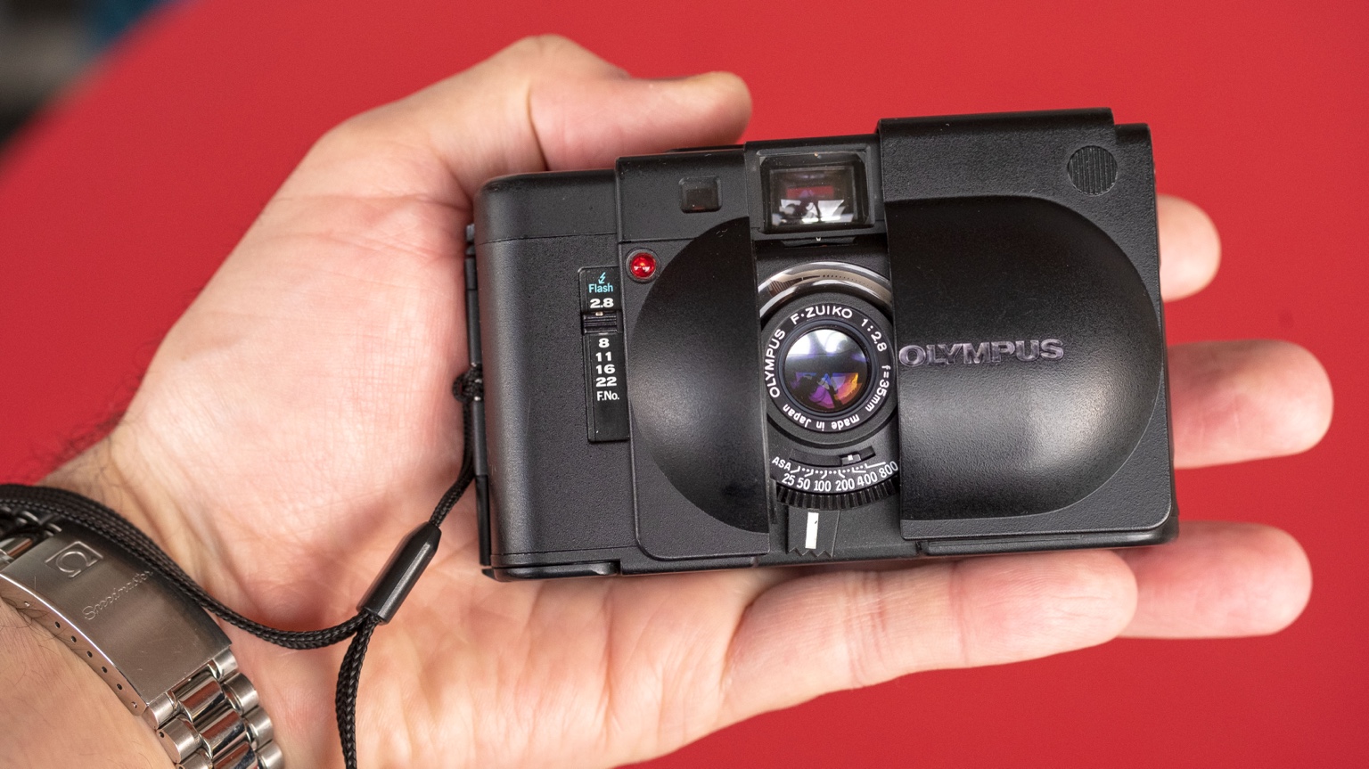 A close view of the tiny Olympus rangefinder and its simple manual controls.