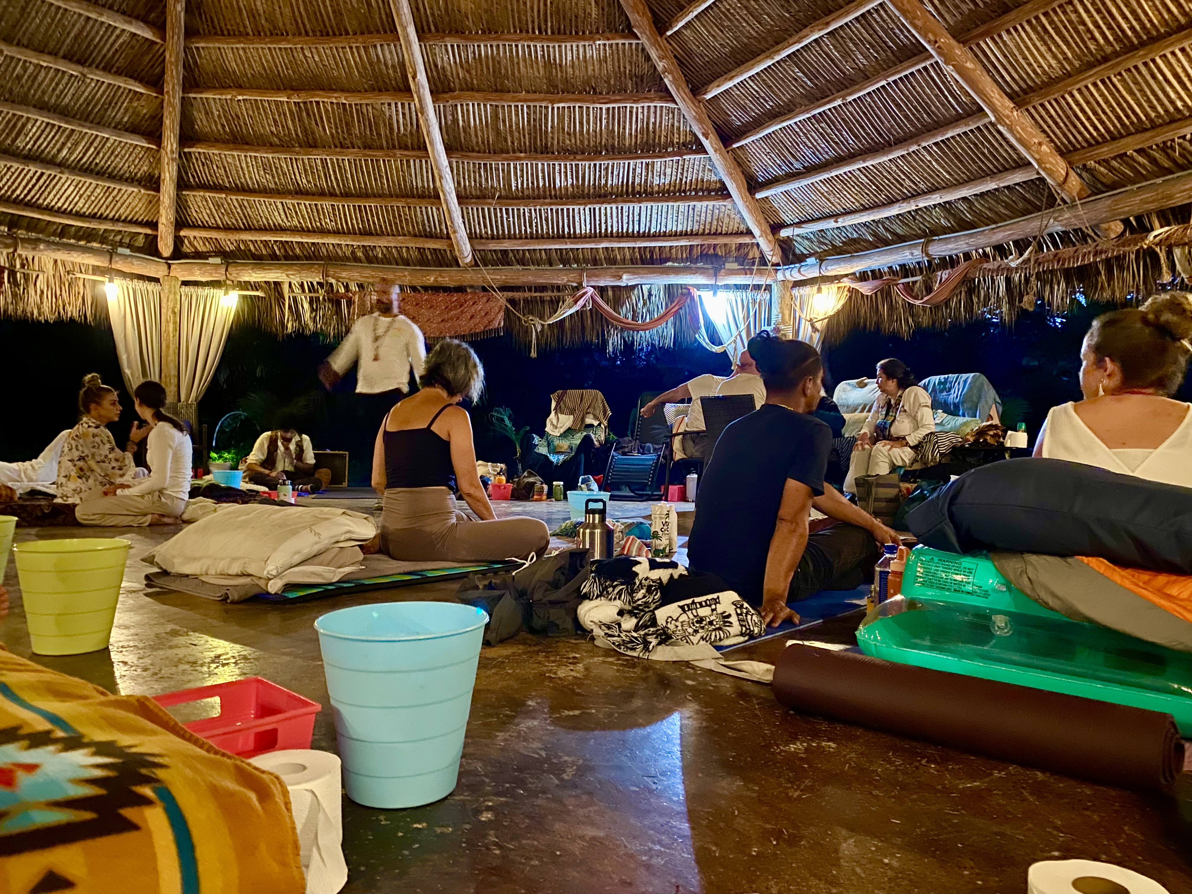 Participants preparing the open-air pavilion before ceremony.