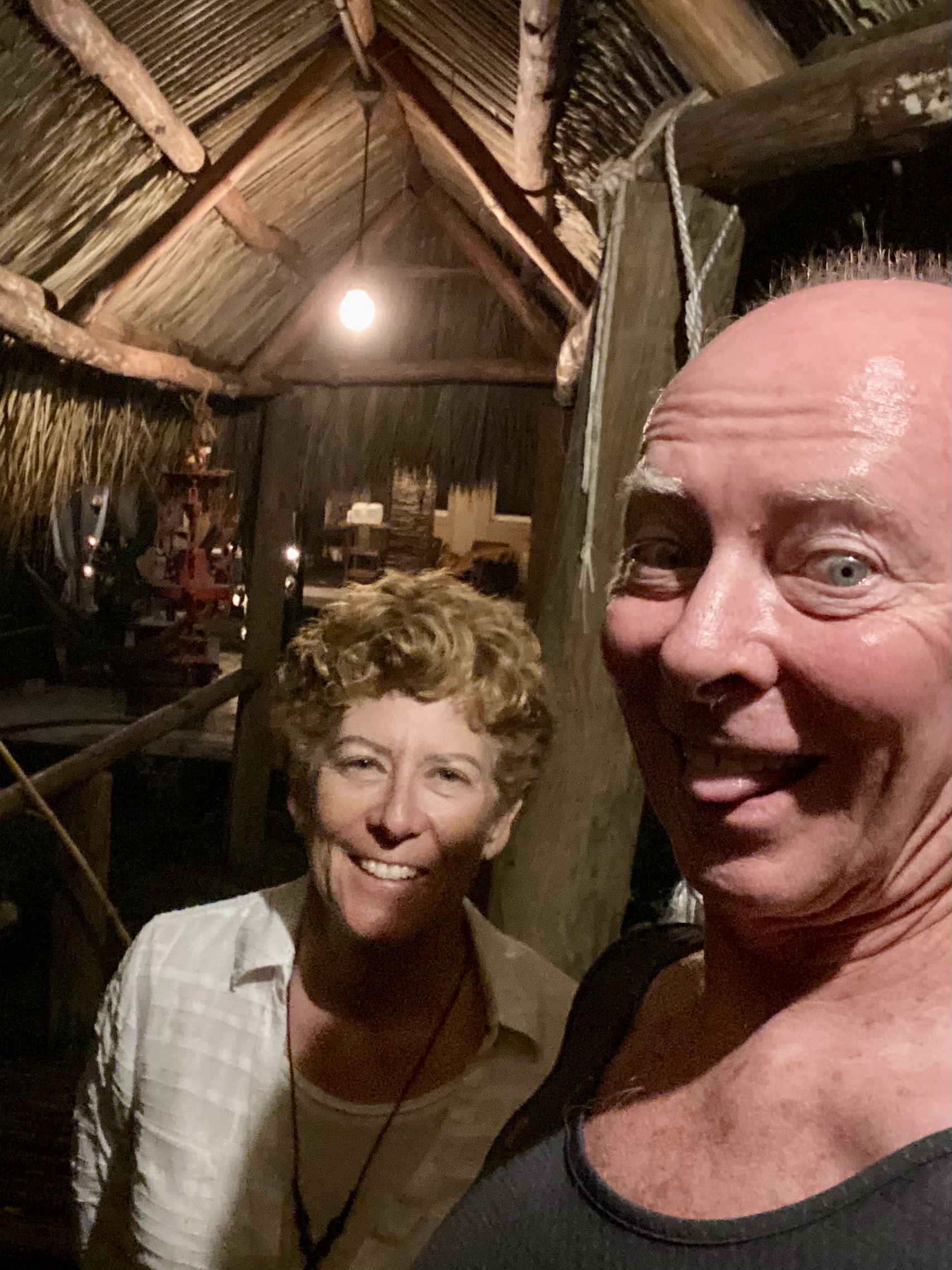 Kym and Tim sharing a smile during a quiet moment between ceremonies.
