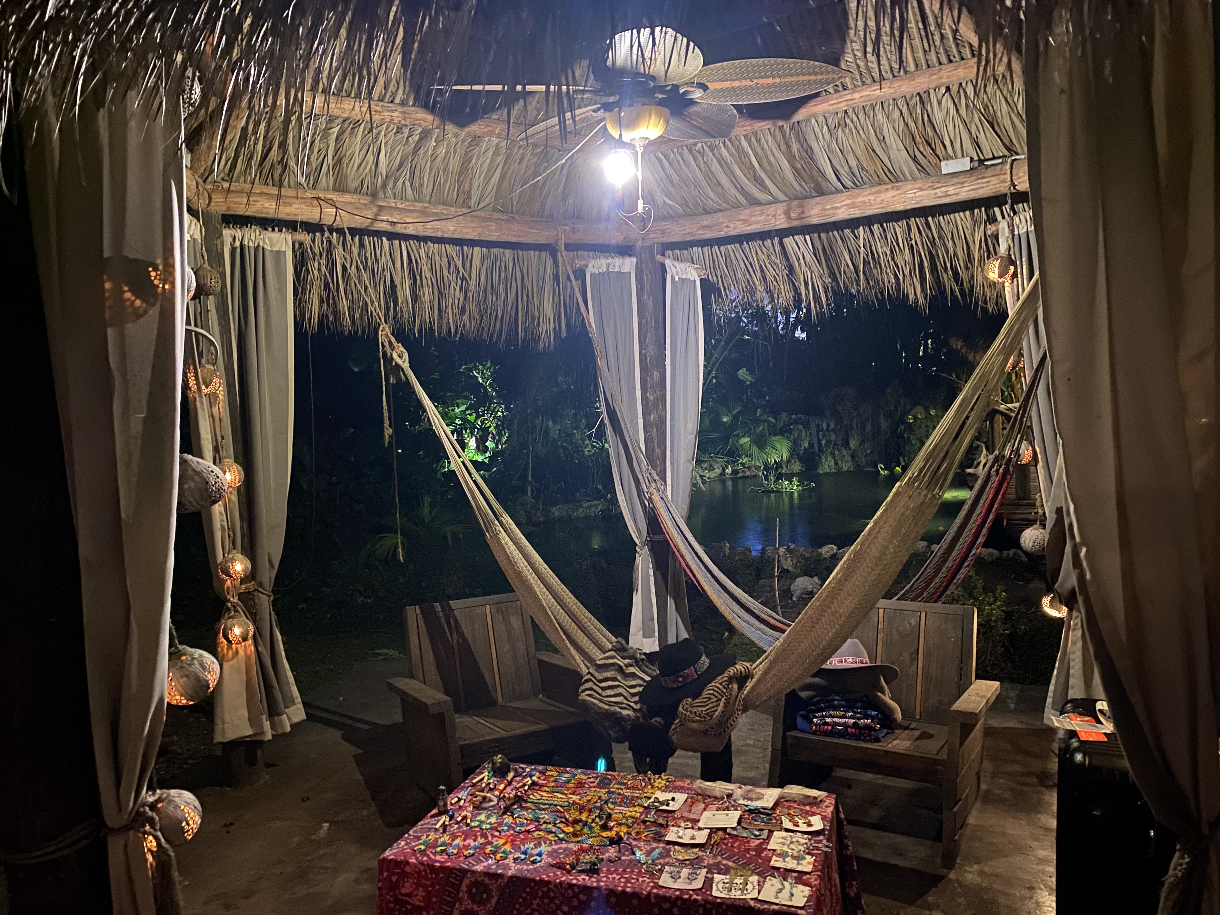 A private resting alcove tucked beneath the thatched roof.