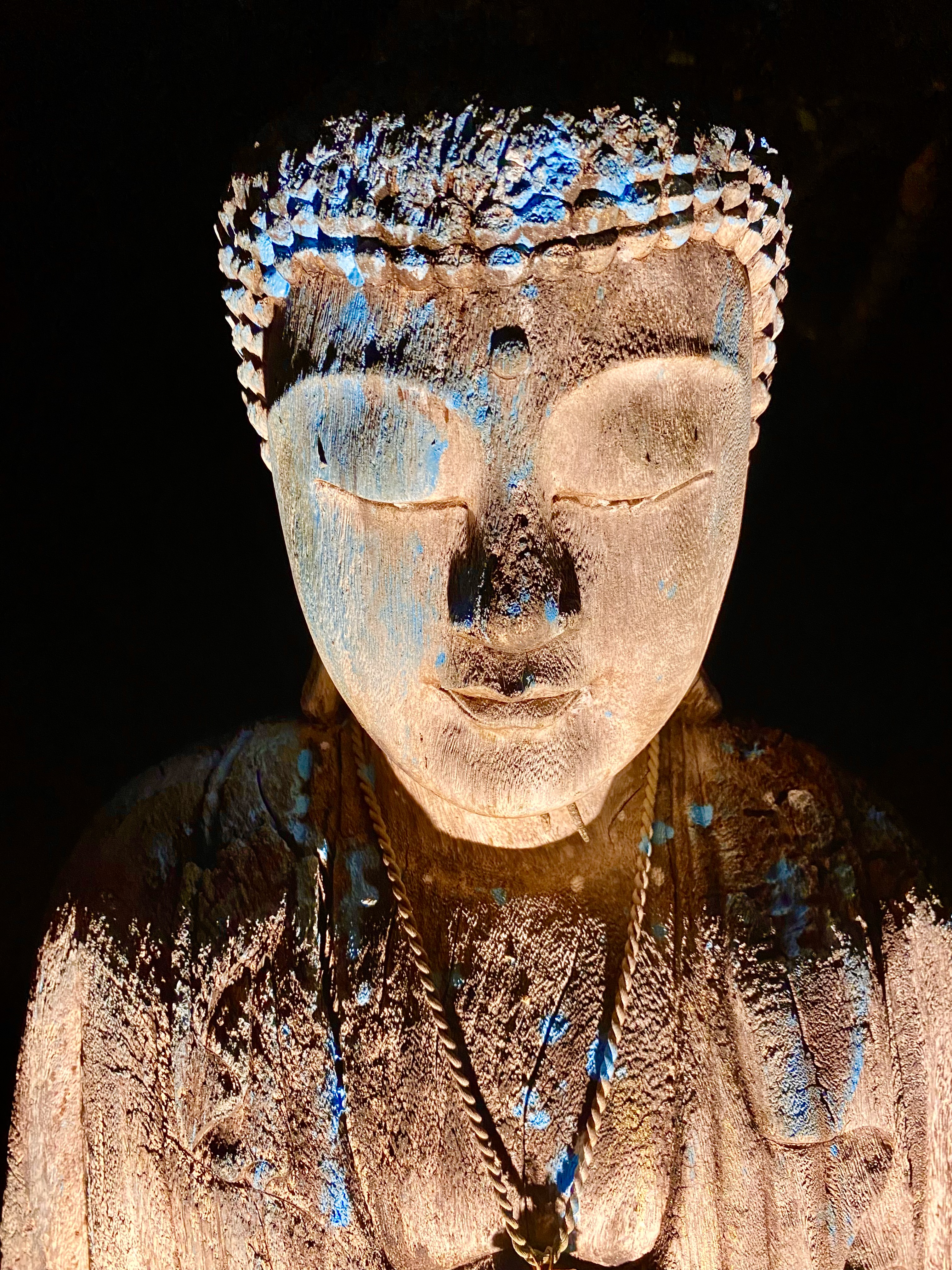 A contemplative sculpture among the retreat’s spiritual artwork.