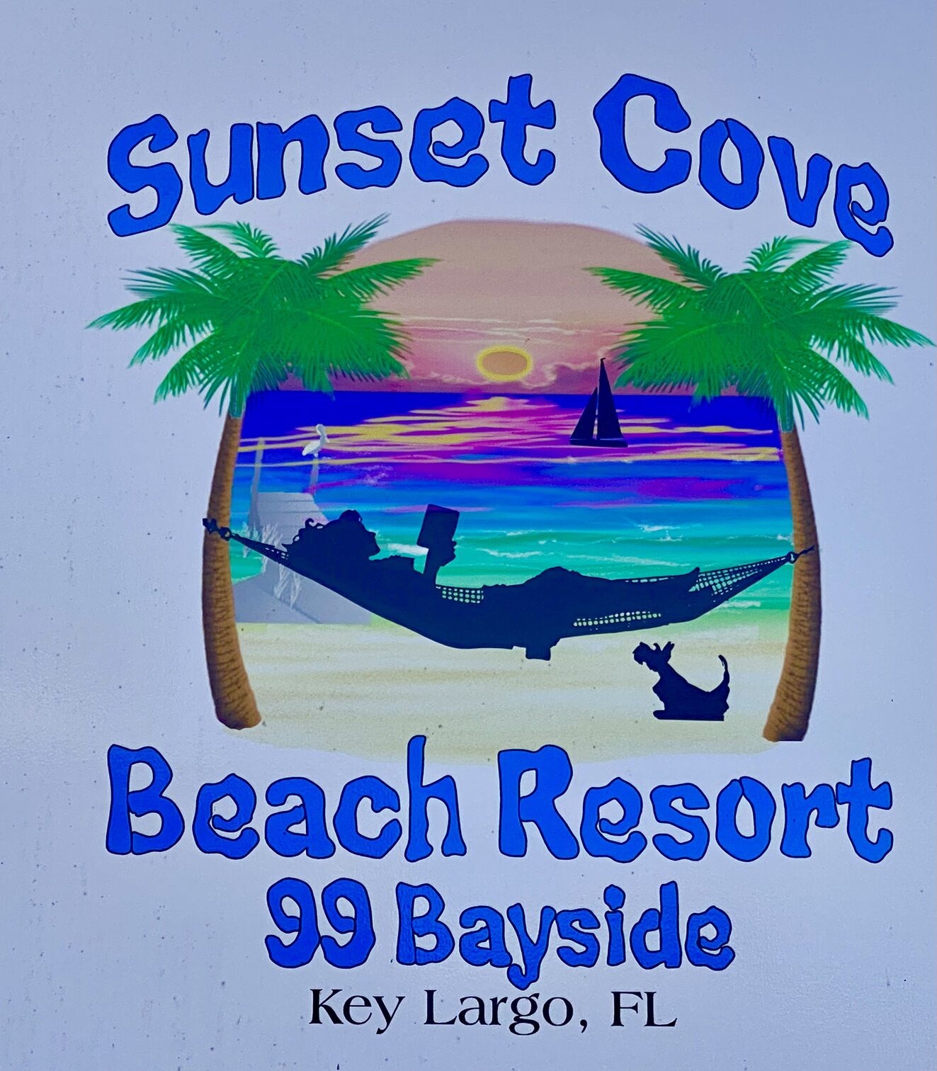 The cheerful Sunset Cove Beach Resort sign.