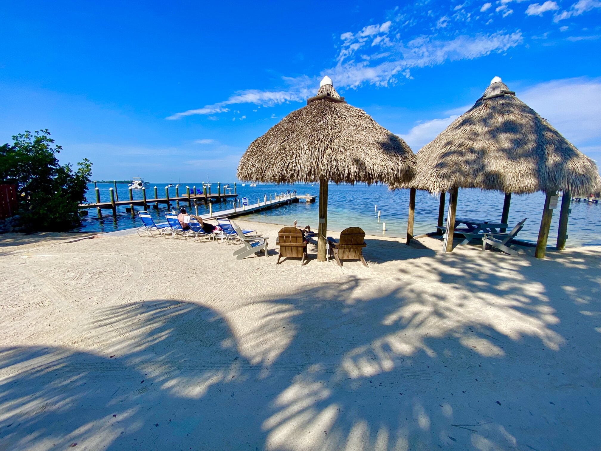 Tiki huts and lounge chairs beside Florida Bay.