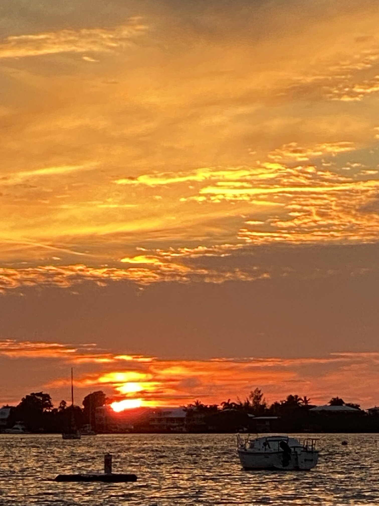 Sunset reflections stretching across the bay.