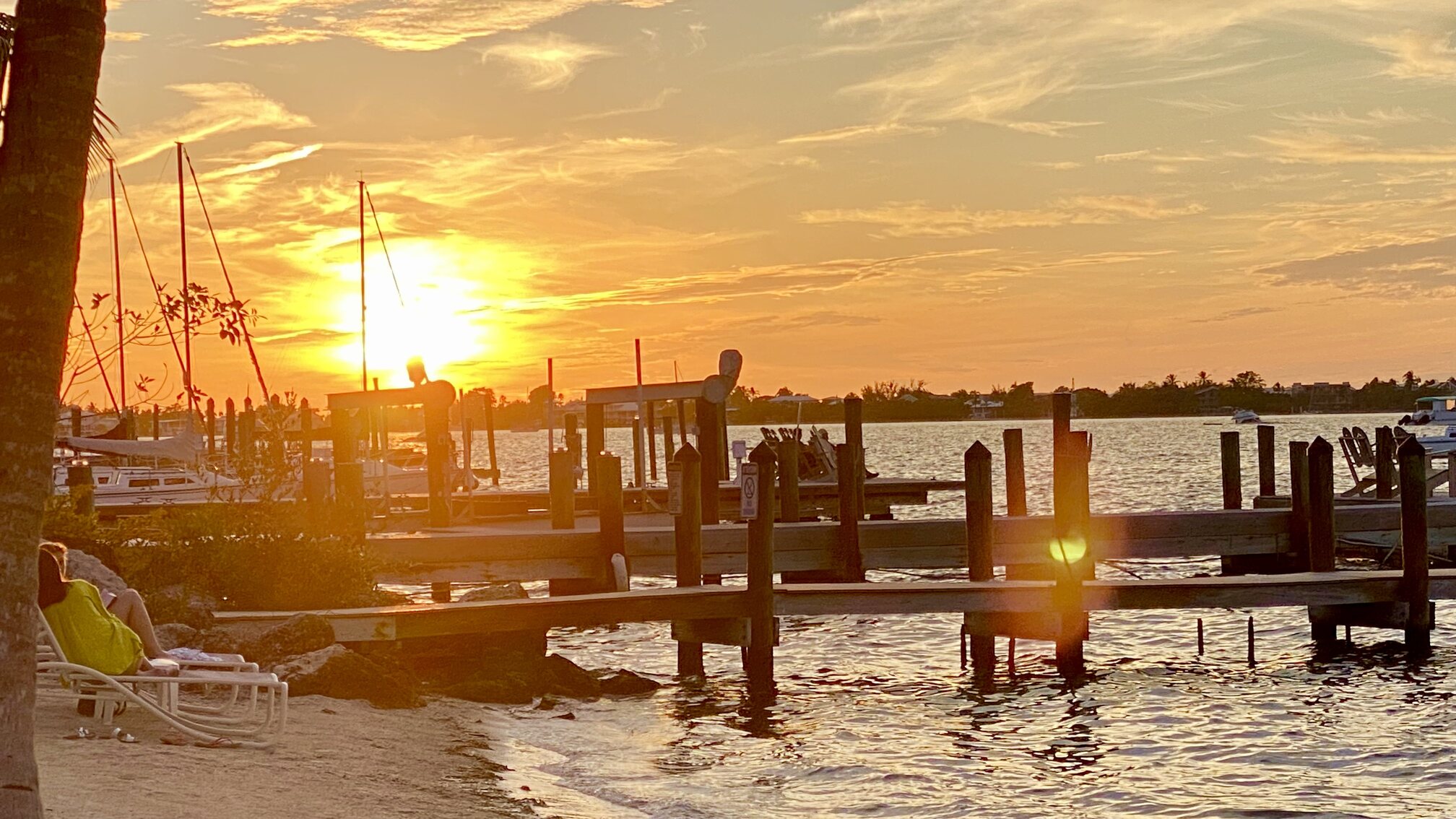 The setting sun glowing through the waterfront docks.