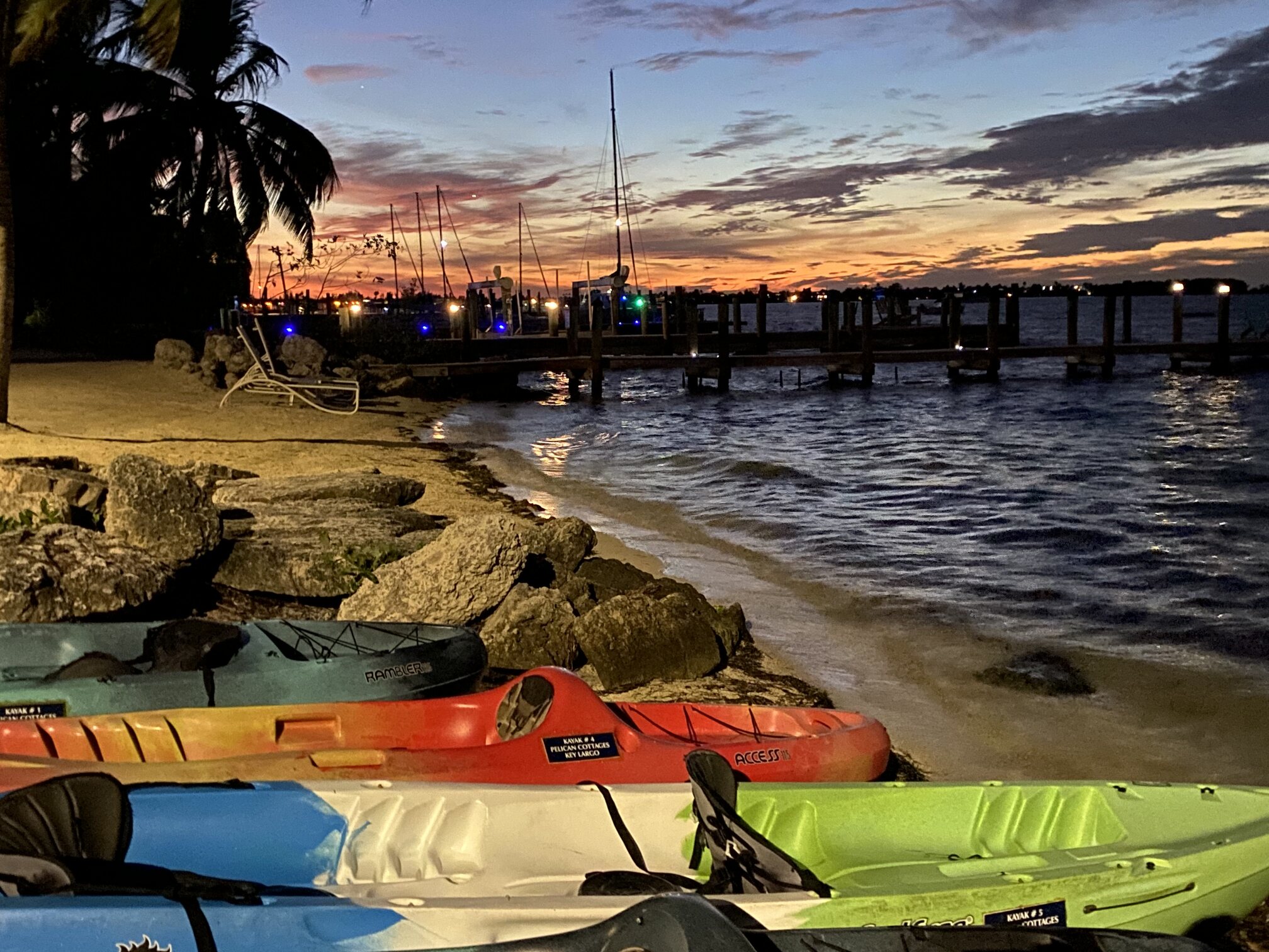 The shoreline and kayaks just after sunset.