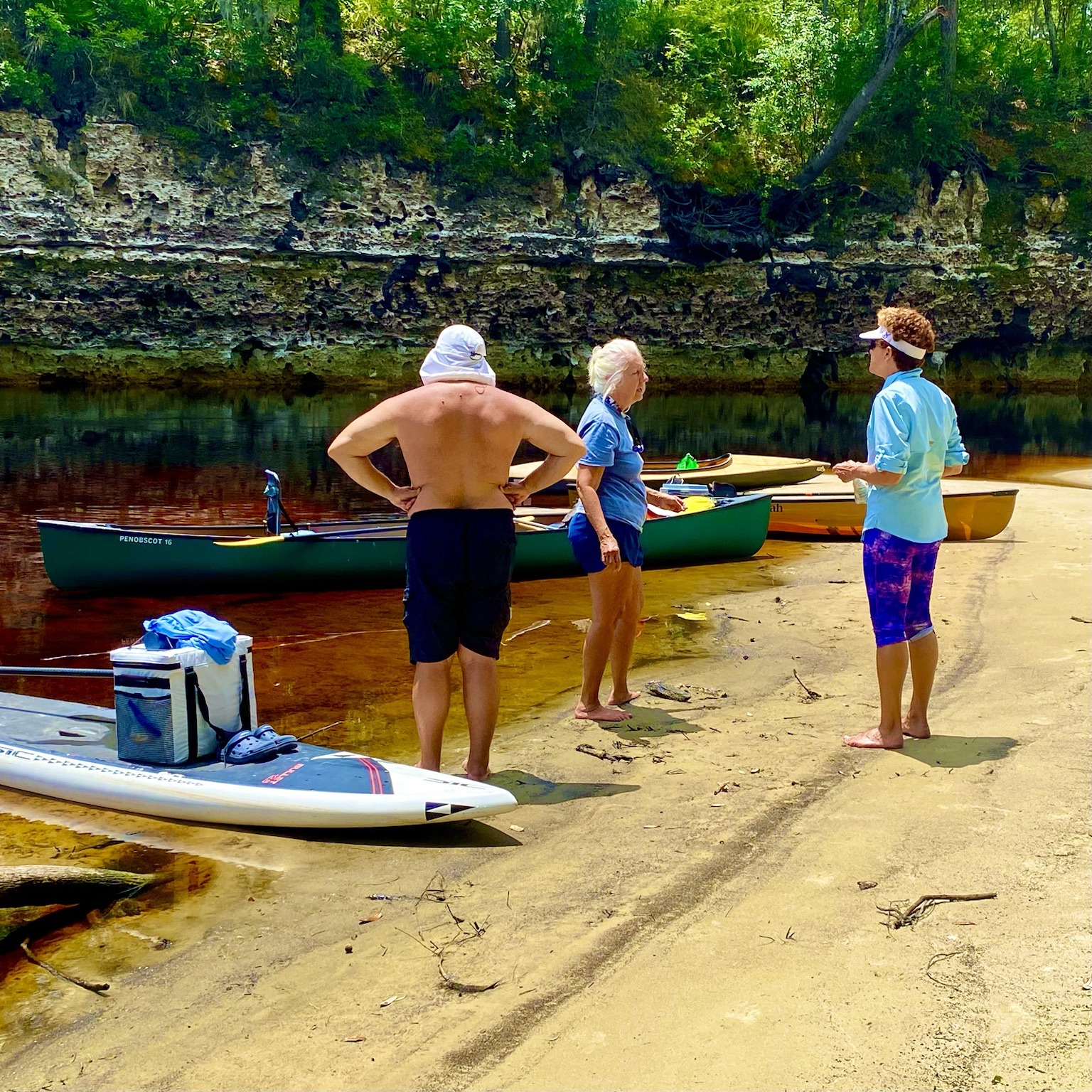 Stretching our legs on a broad sandy landing beside the river.