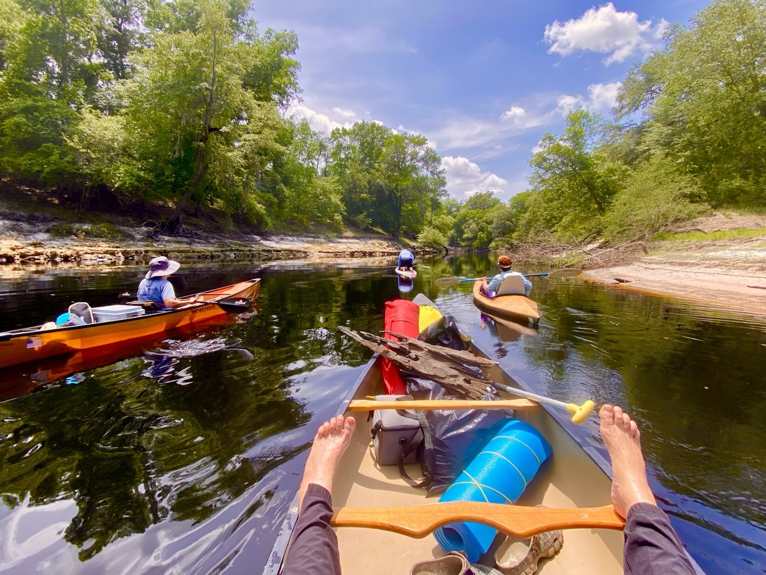 Following the group through another narrow, winding stretch of river.